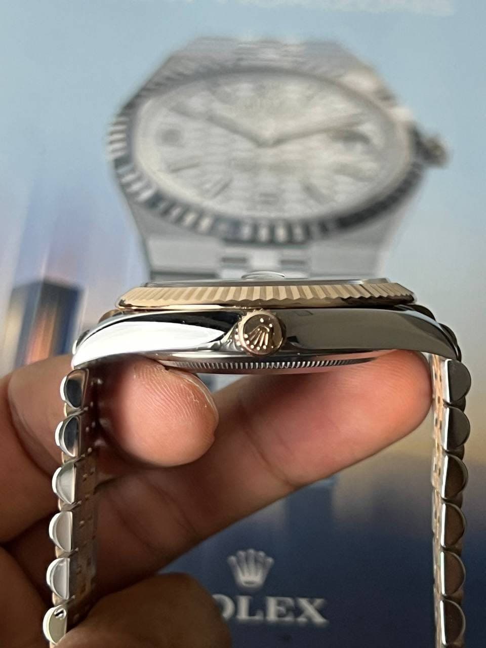 May be an image of wrist watch and text