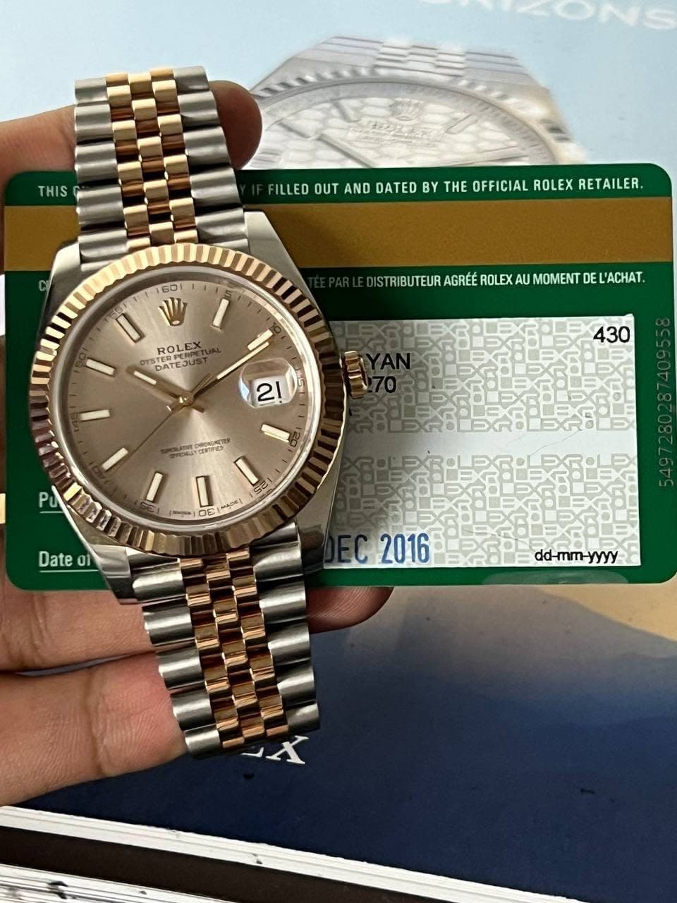 May be an image of wrist watch and text that says 'THIS ILLED OUT AND DATED BY THE OFFICIAL ROLEX RETAILER. 6DI 0 W TERPERPE ROLEX EX TERPURO TEJUS DATEJUS ISTRIBUTEUR AGRÉÉ ROLEX…