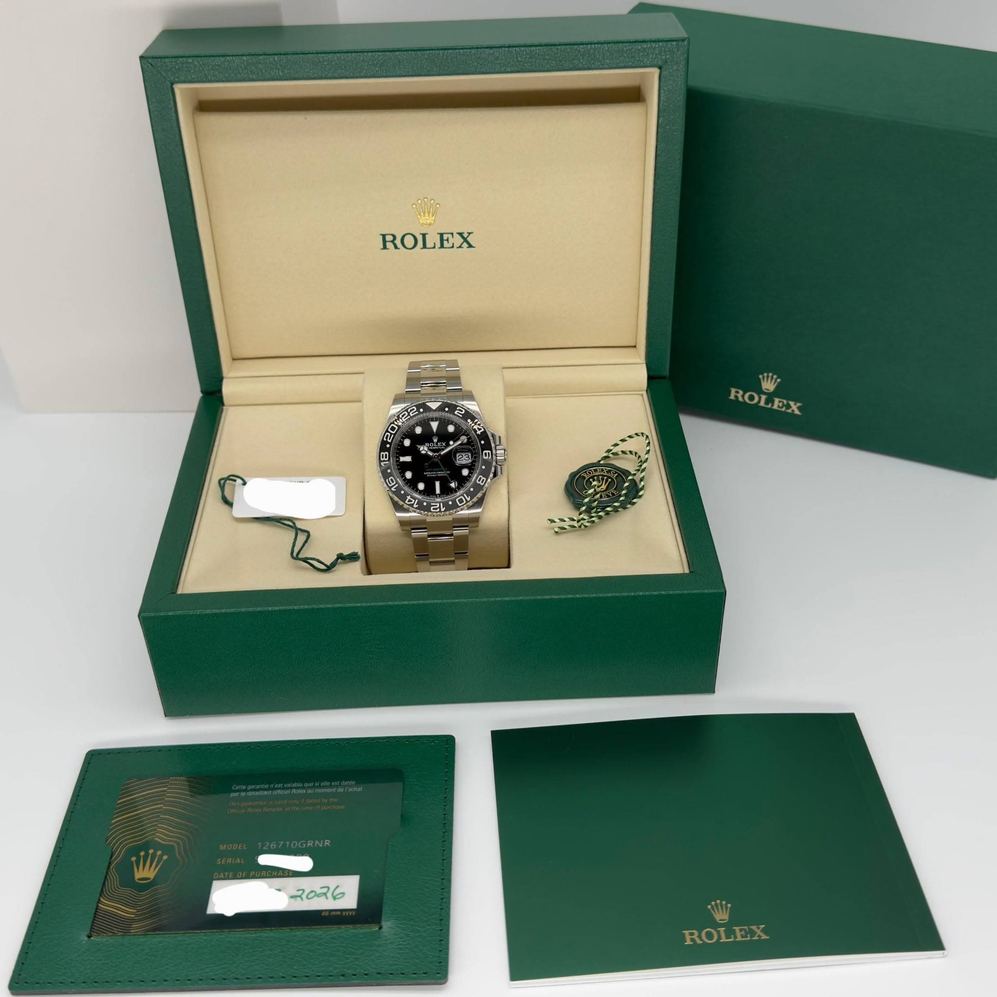 May be an image of wrist watch and text that says 'ROLEX 명 2 총 TPlt ROLEX EX ROL c 7026 ROLEX'