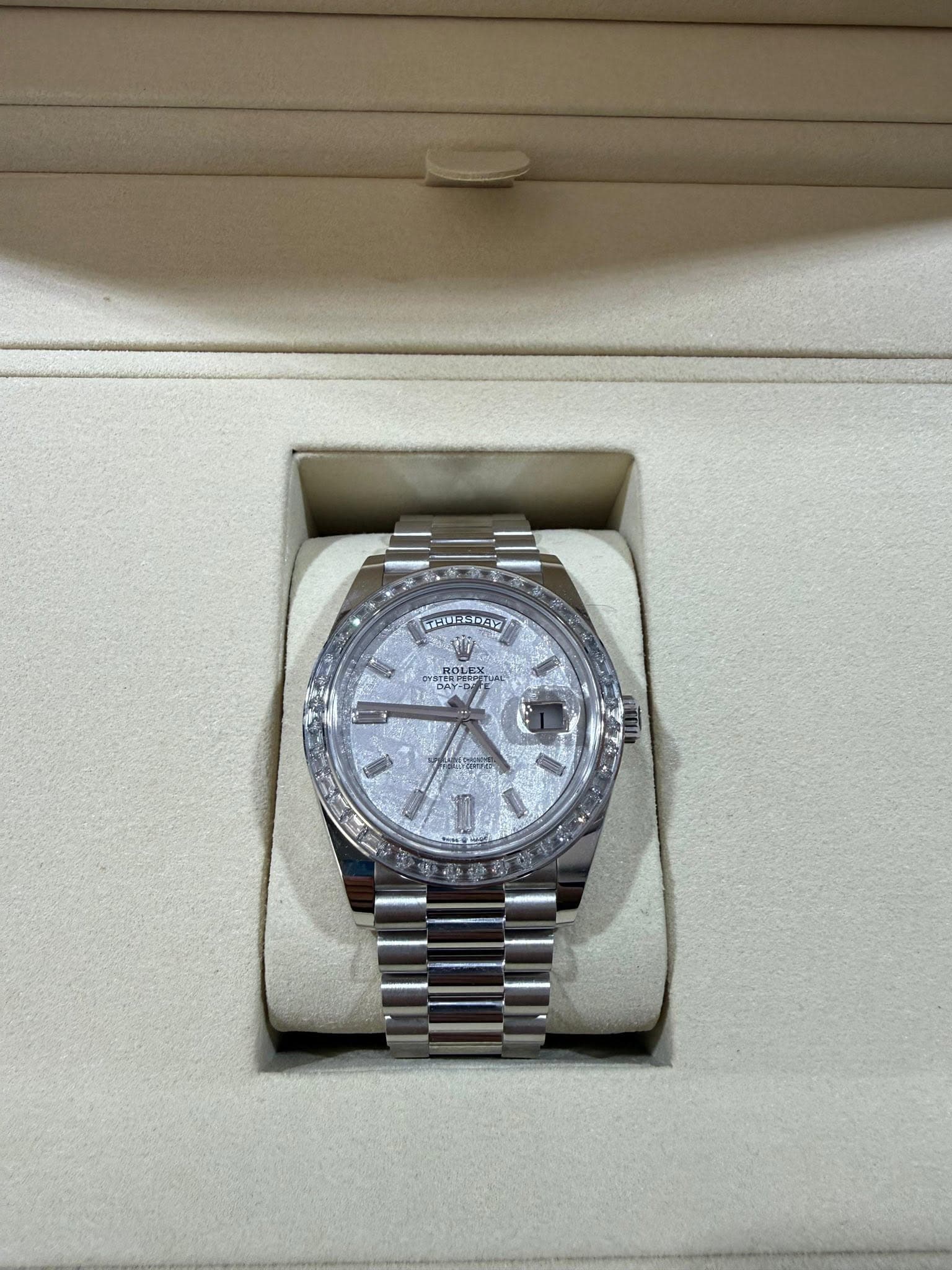 May be an image of wrist watch and text