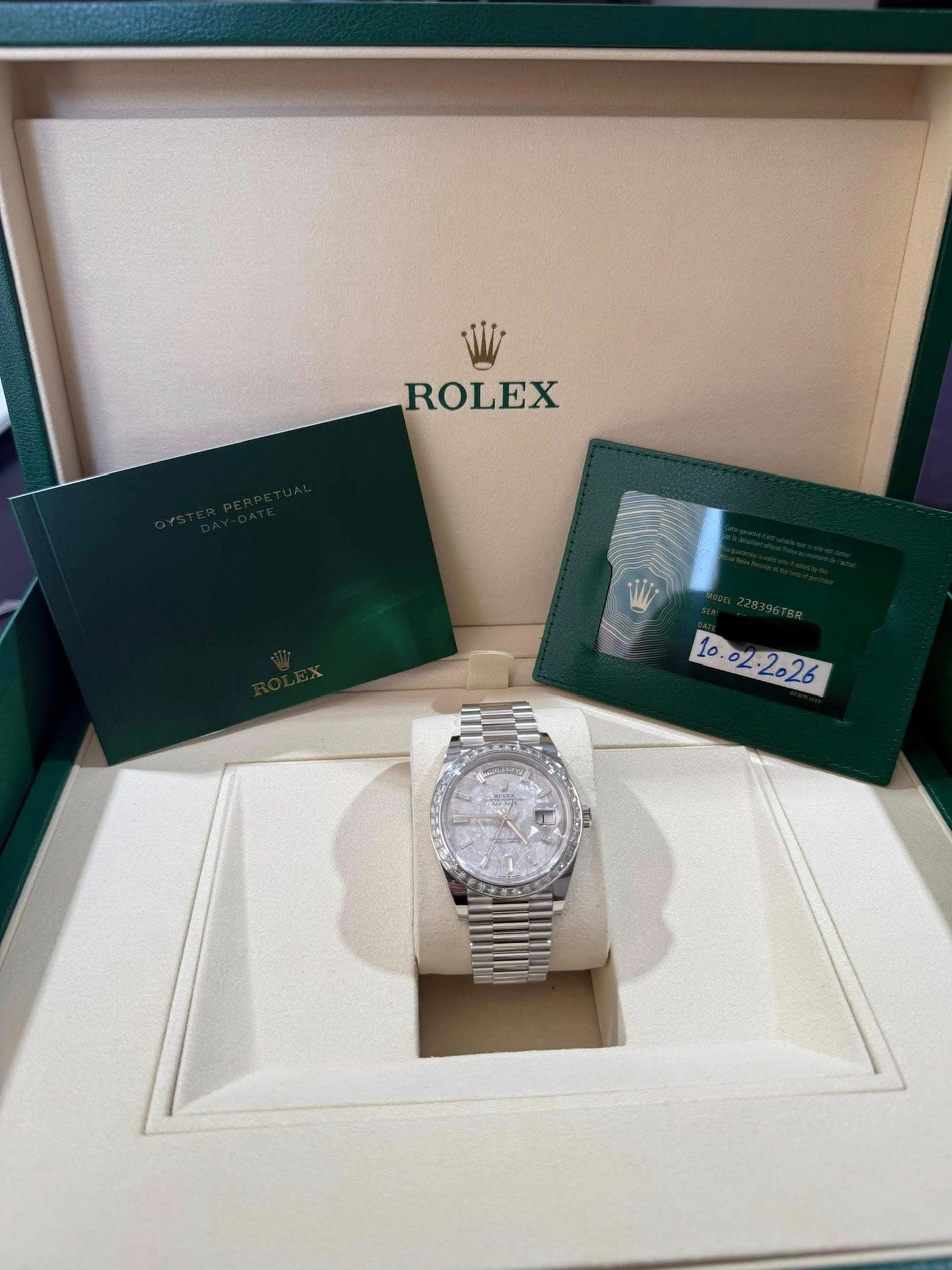 May be an image of wrist watch and text that says 'ROLEX ALP 10.02:2026 Ο y B'