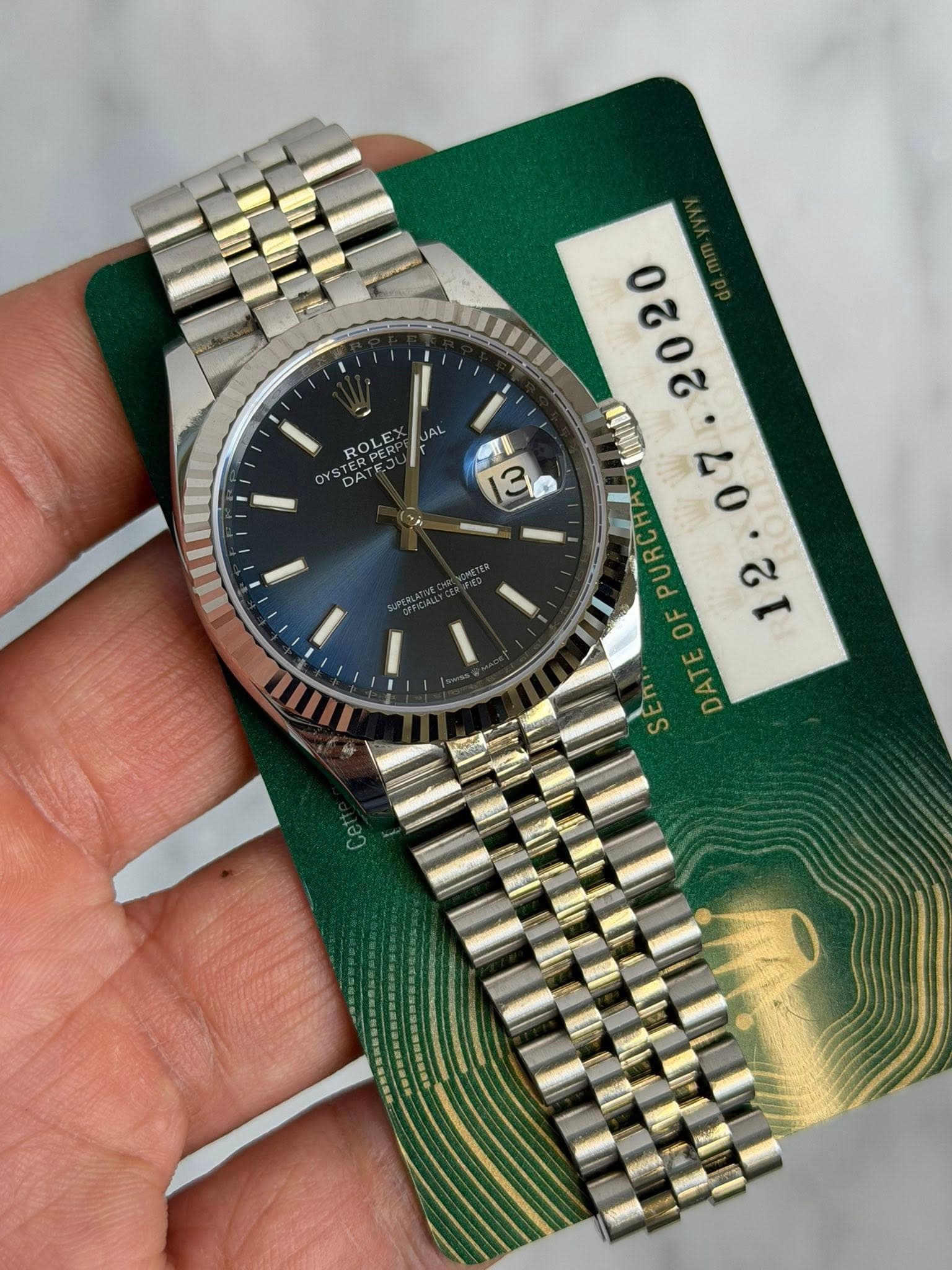 May be an image of wrist watch and text that says 'ROLE ម្ង 3 專啊 PUR JR 3 0 هي ခ SEn DAT DATEOFPURO DA SE S'