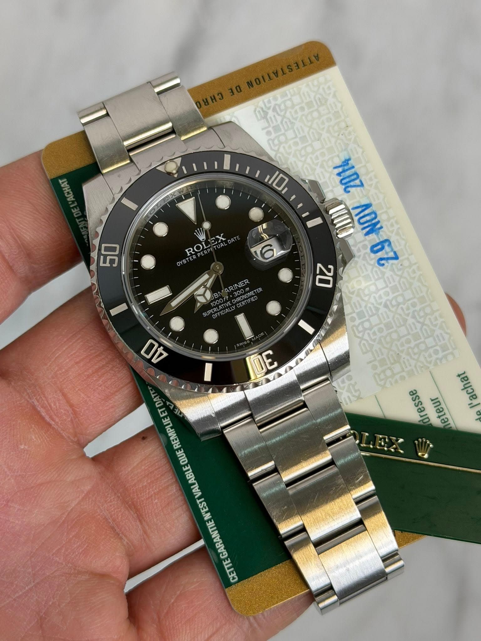 May be an image of wrist watch and text that says 'ጠአአ 大 10 IE 50 ROLE 礼 M店 ΛΟΝ 62 20 00 DE の2 'achat heteur QUE VALABLE N'EST GARANTIE CETTE'