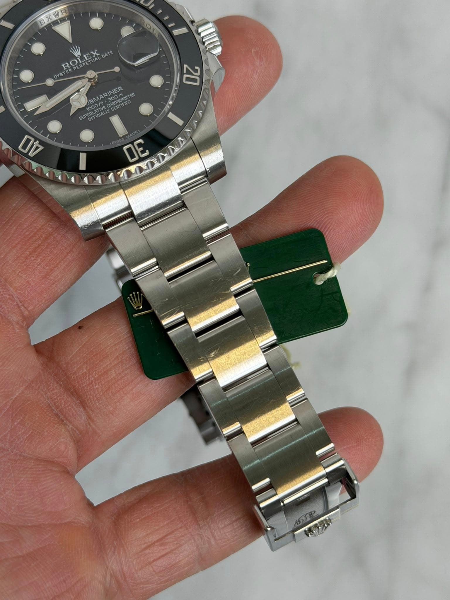 May be an image of wrist watch and text that says 'EXWR ROLEX 20 40 OE MDANA MA'