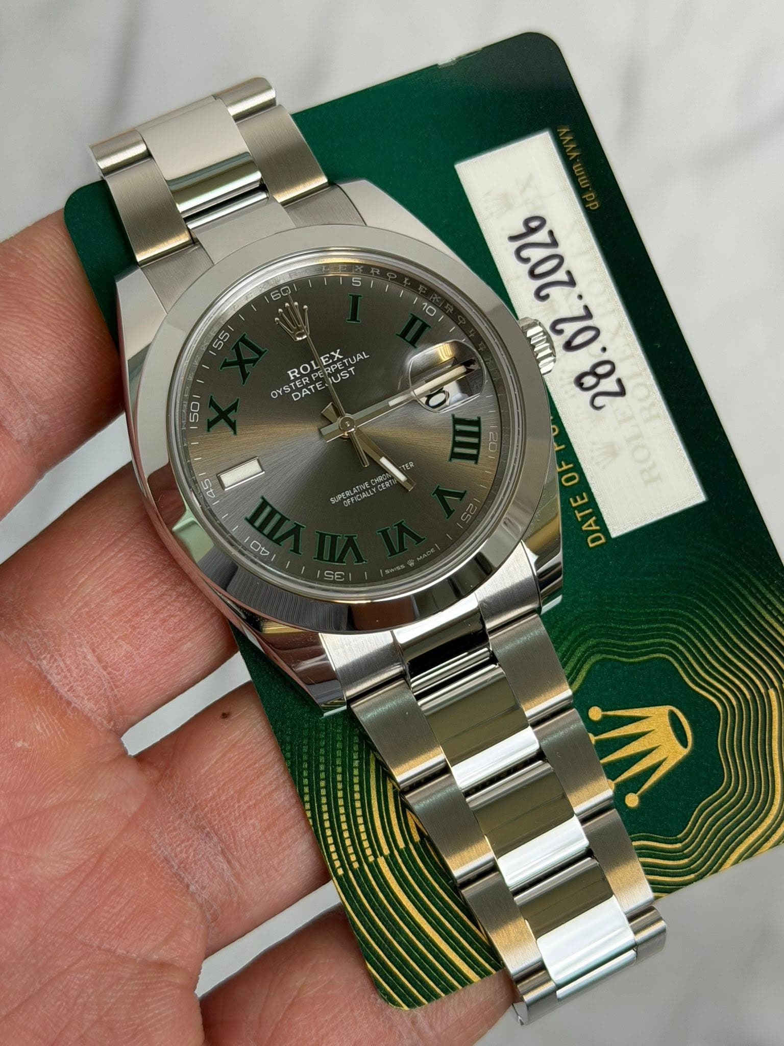 May be an image of wrist watch and text