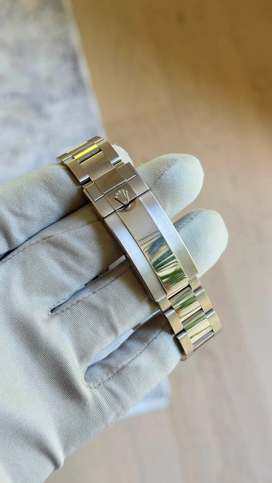 May be an image of wrist watch and jewelry