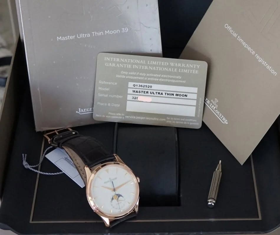 May be an image of wrist watch and text that says 'Master Ultra Thin Moon MasterUltraThinMoon39 39 INTERNATIONAL LIMITED INTERNATIONALI WARRANTY GARANTIE LIMITEE Valide…