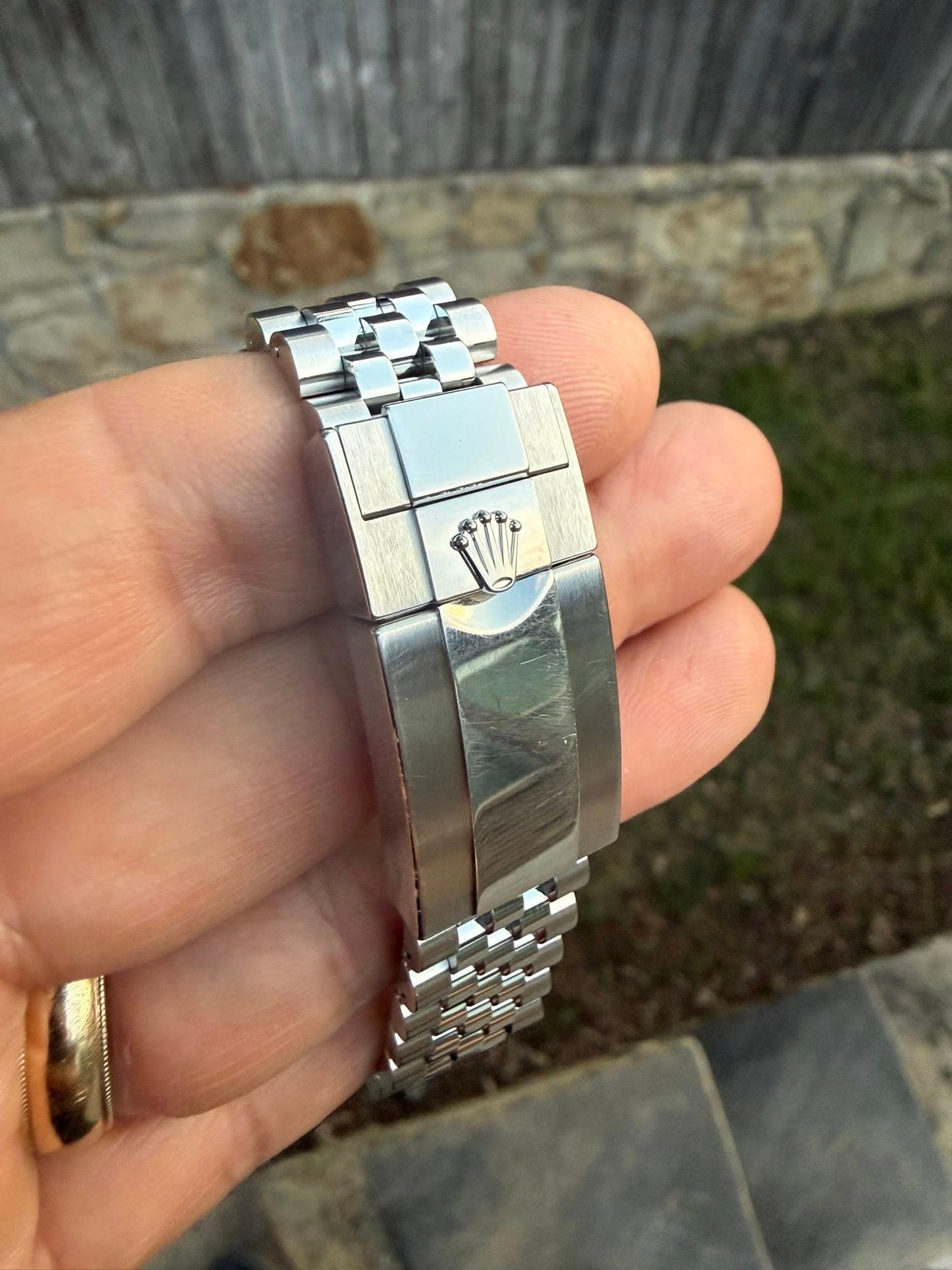 May be an image of wrist watch and jewelry
