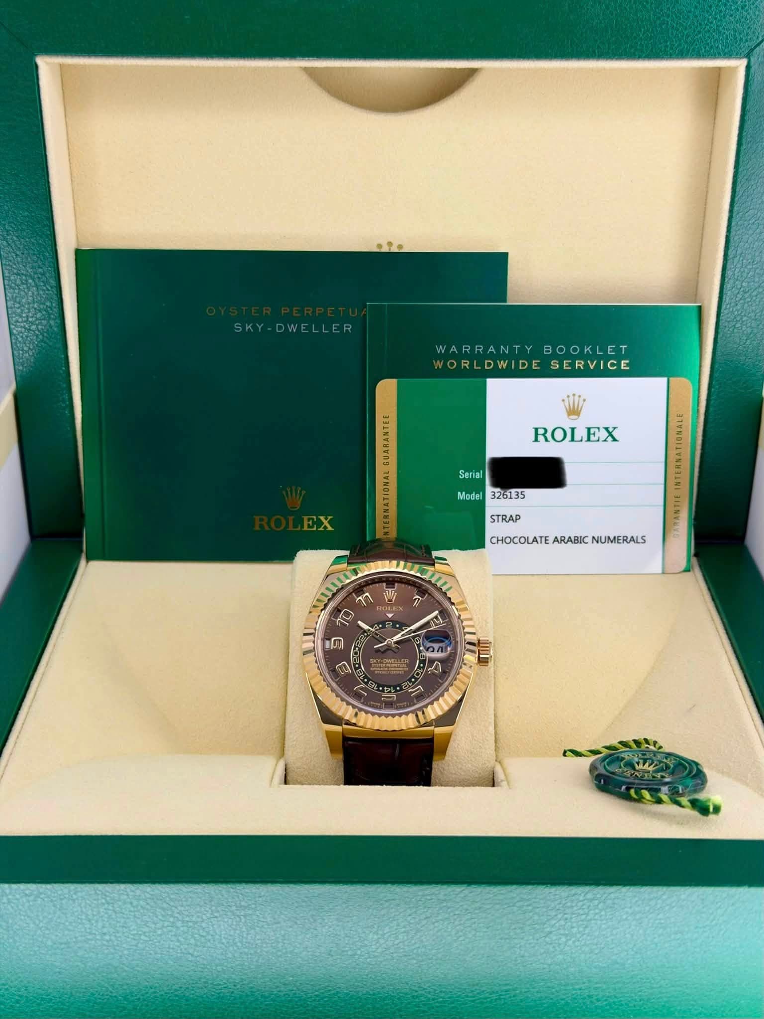May be an image of wrist watch and text that says 'SKY-DWELLER SKY WARRANTY WARRANTYBOOKLET BOOKLET WORLDWIDESERVICE ORLDWIDE SERVICE ROLEX Serial Model 326135 STRAP…