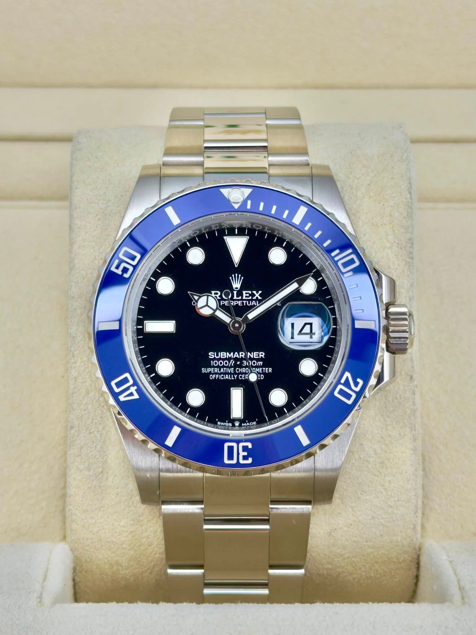 May be an image of wrist watch and text that says '50 ROLEX EX PERPETUA TUAL 10 nл MI 14 SUBMAR NER 1000ft 300T SUPERLATIV PERLATINE O00 CHROLO ETER OFFIRALI OFFICIALLY FFICIALL…