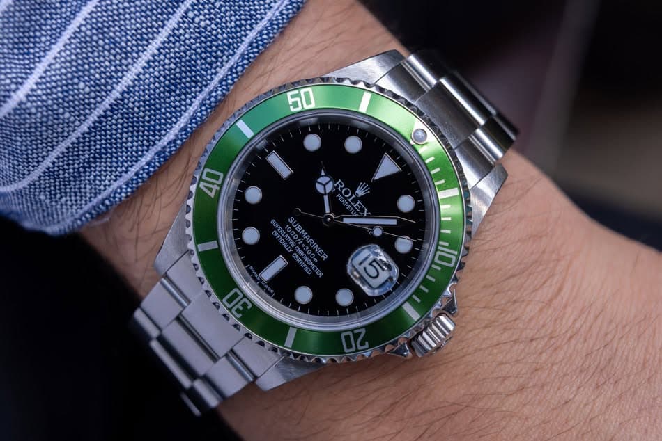 May be an image of wrist watch and text that says '50 40 RODESE ROLE ROL SUBMARINER ATIVE_CSRON SURAE SUBMARINER CHRONOREC CERTIFIED I '