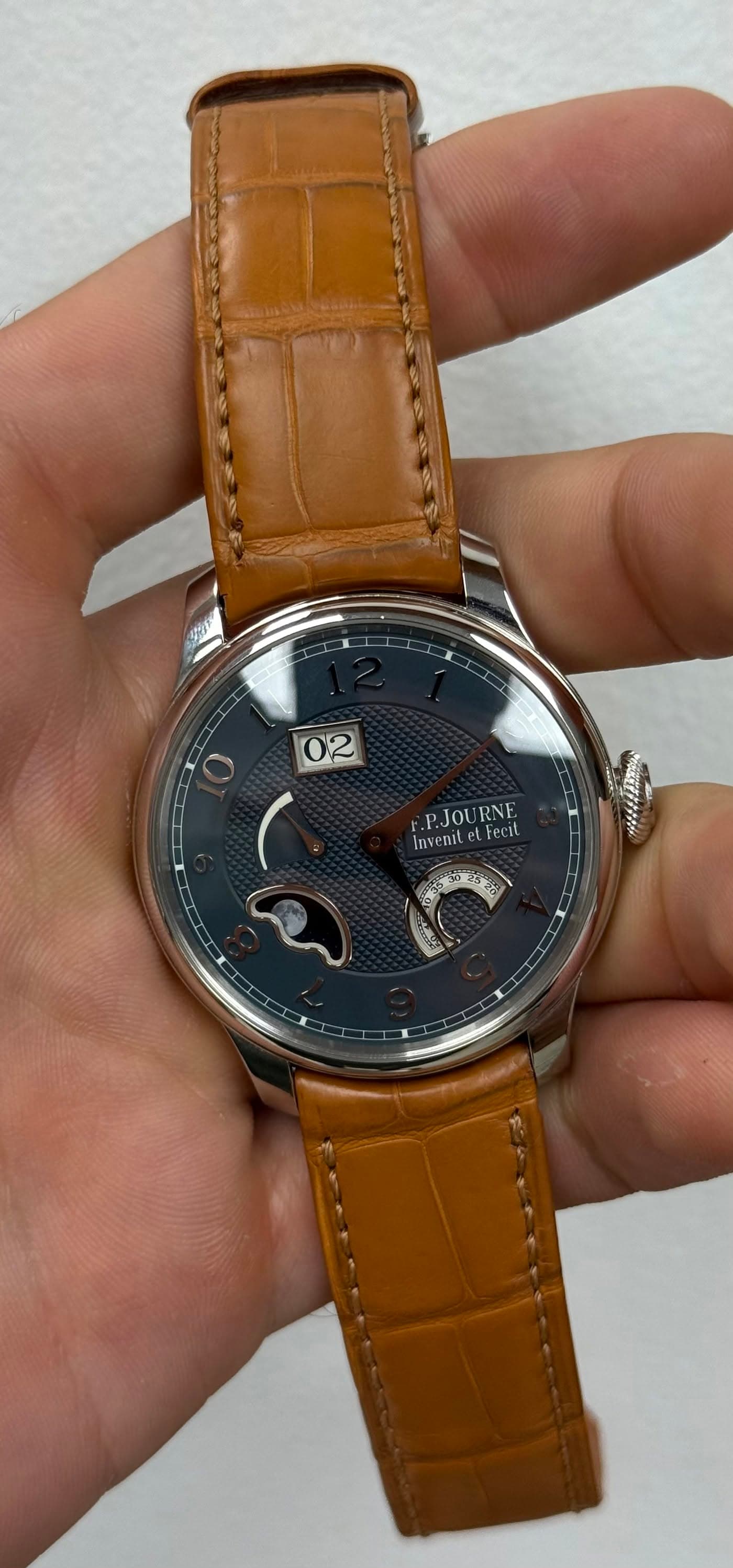 May be an image of wrist watch and text