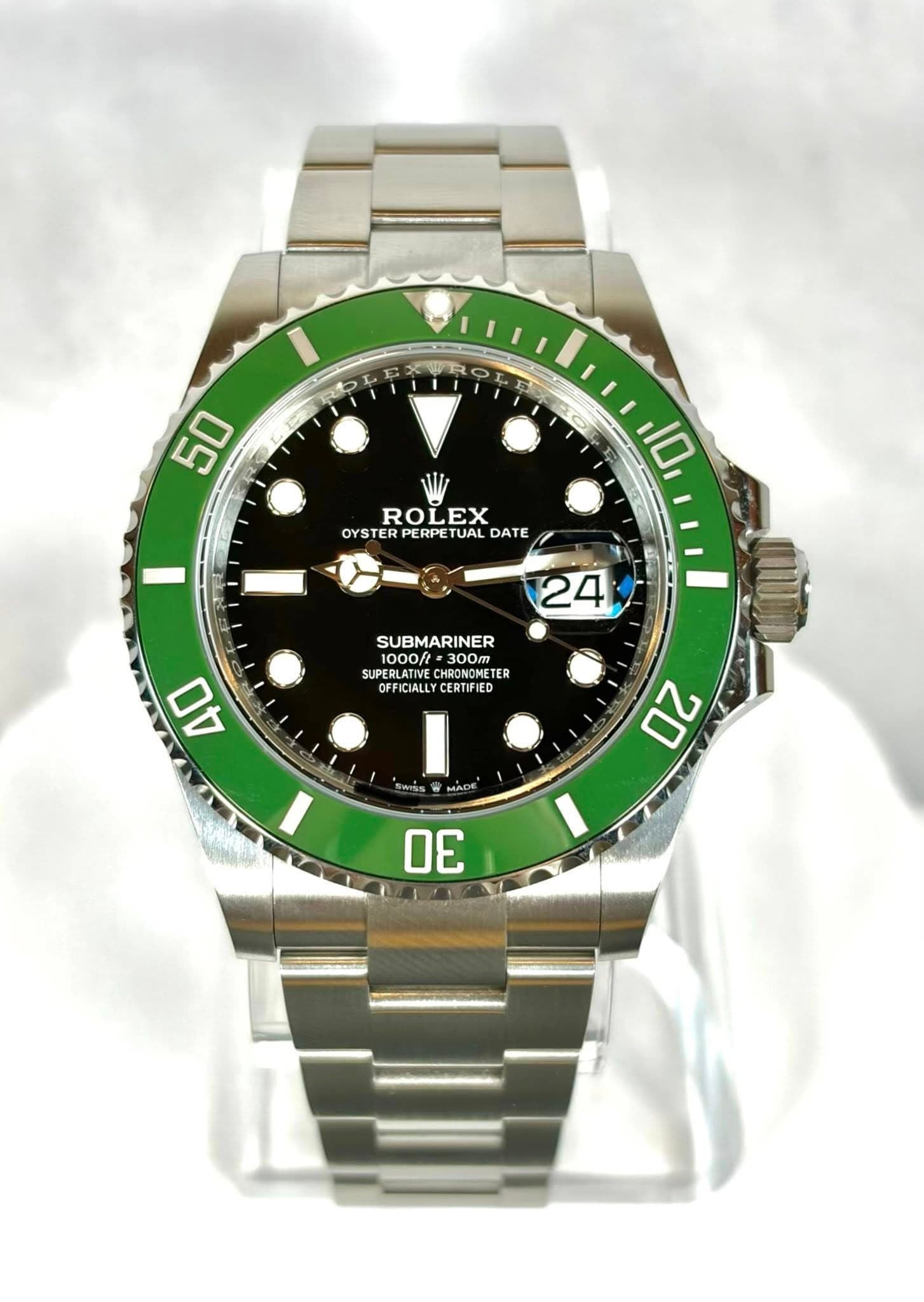 May be an image of wrist watch and text that says '50 ROL ROLEX OYSTER OYSTERPERPETUALDATE ER PERPE TUAL DATE OYS TER 10 24 SUBMARINER ooH 300T 300m SUPERI CUSERLATINE 1000/…