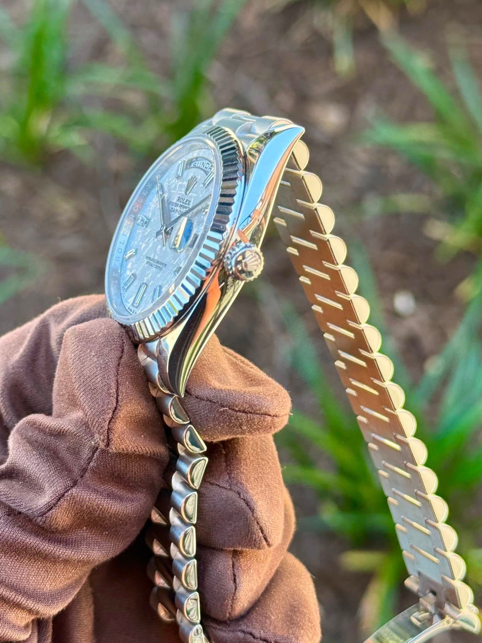May be an image of jewelry, wrist watch and text