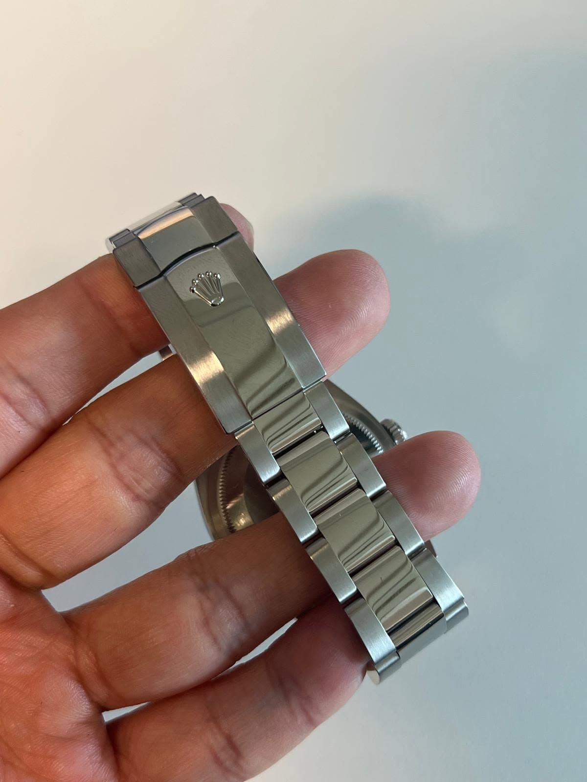 May be an image of wrist watch and text