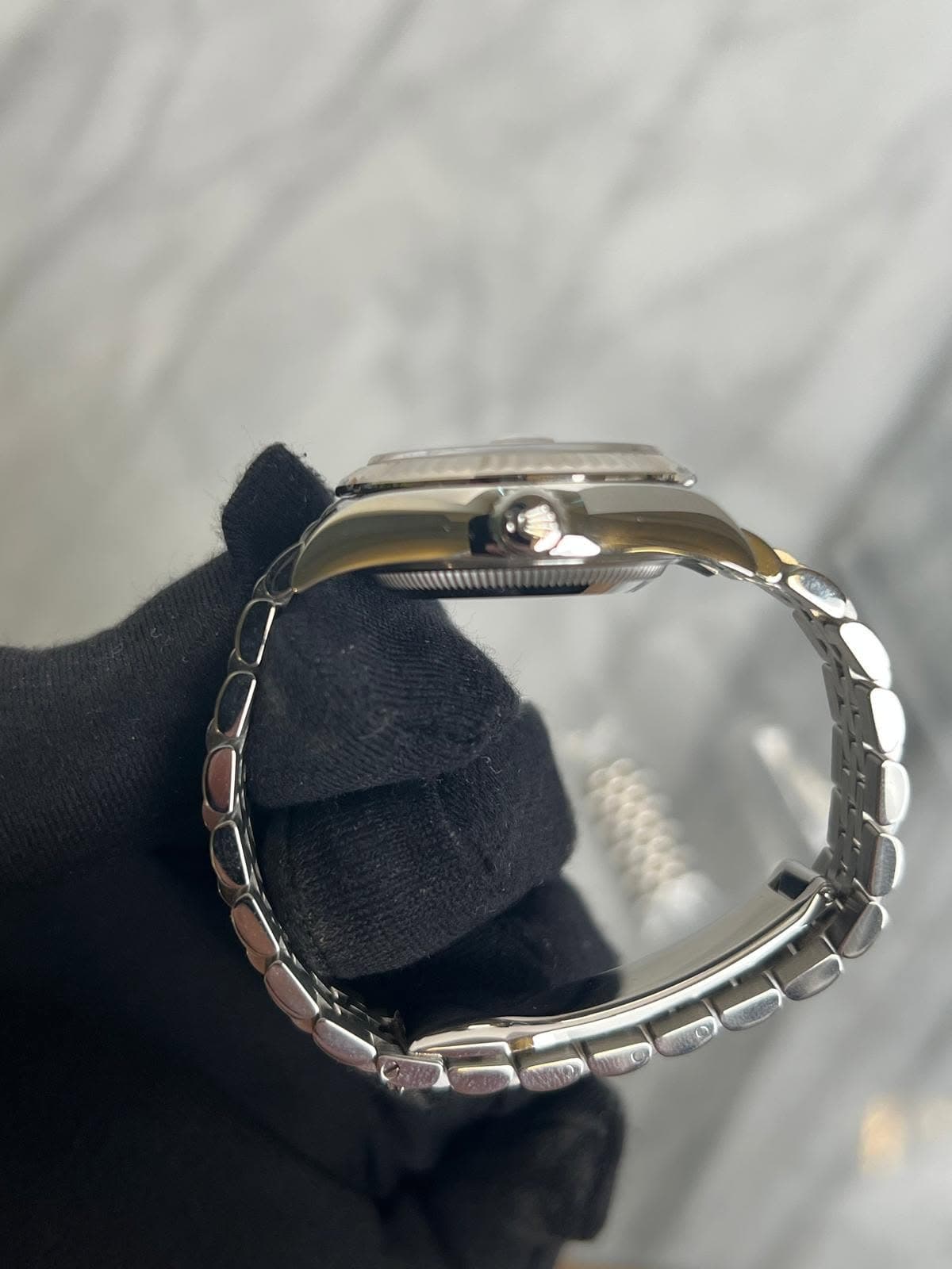 May be an image of wrist watch and jewelry