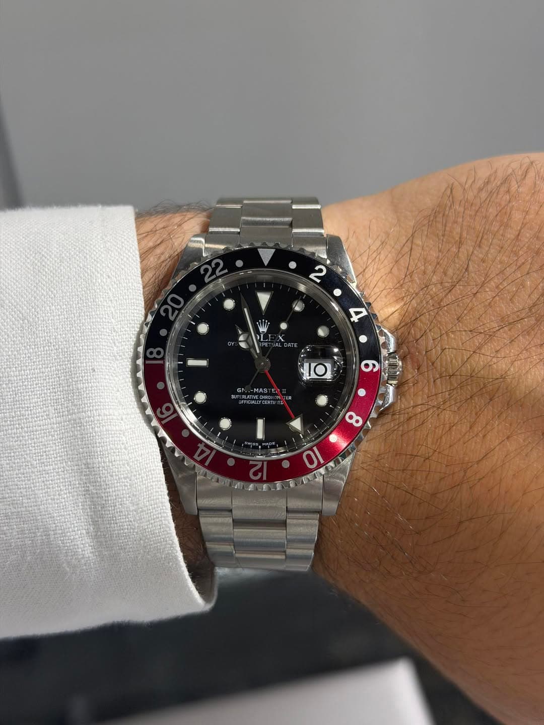 May be an image of wrist watch and text