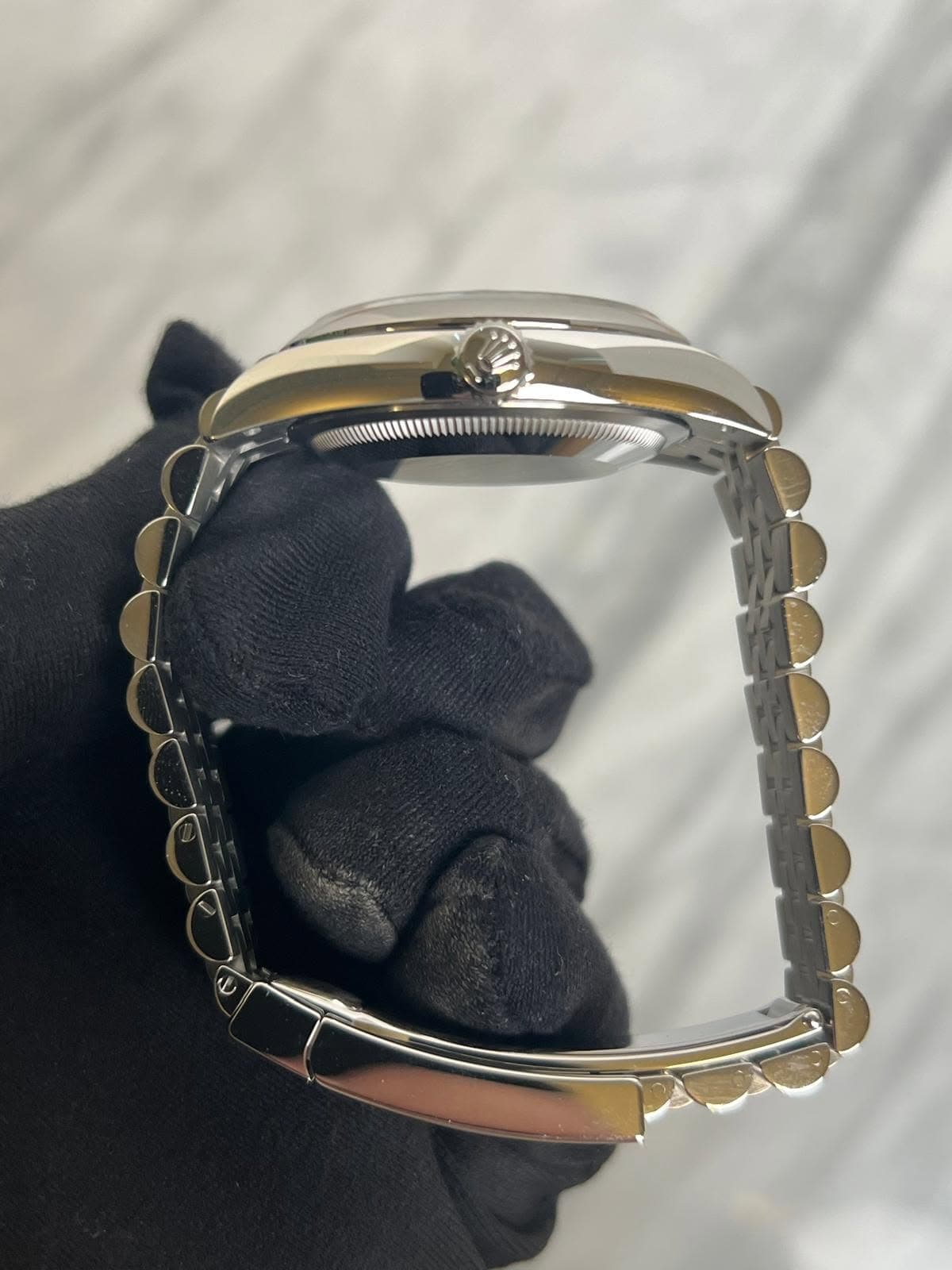 May be an image of wrist watch and jewelry