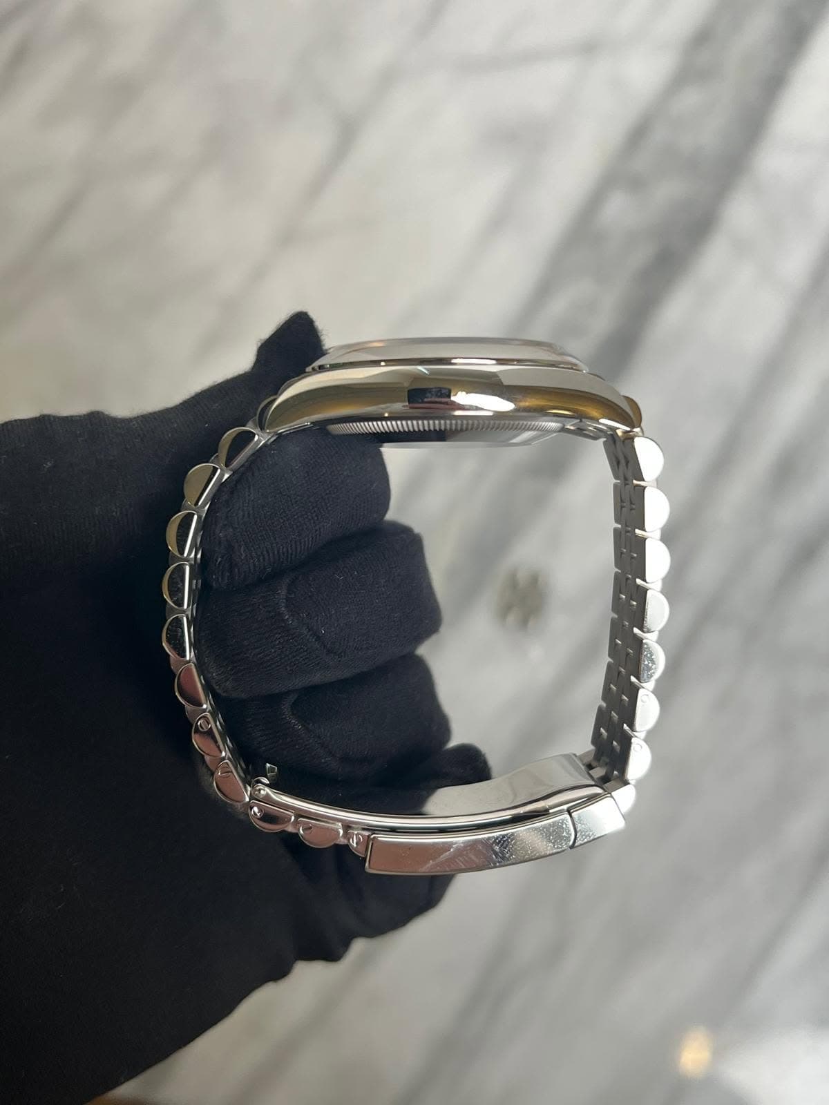 May be an image of jewelry and wrist watch