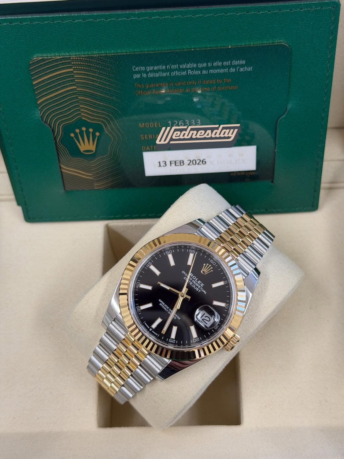 May be an image of wrist watch and text