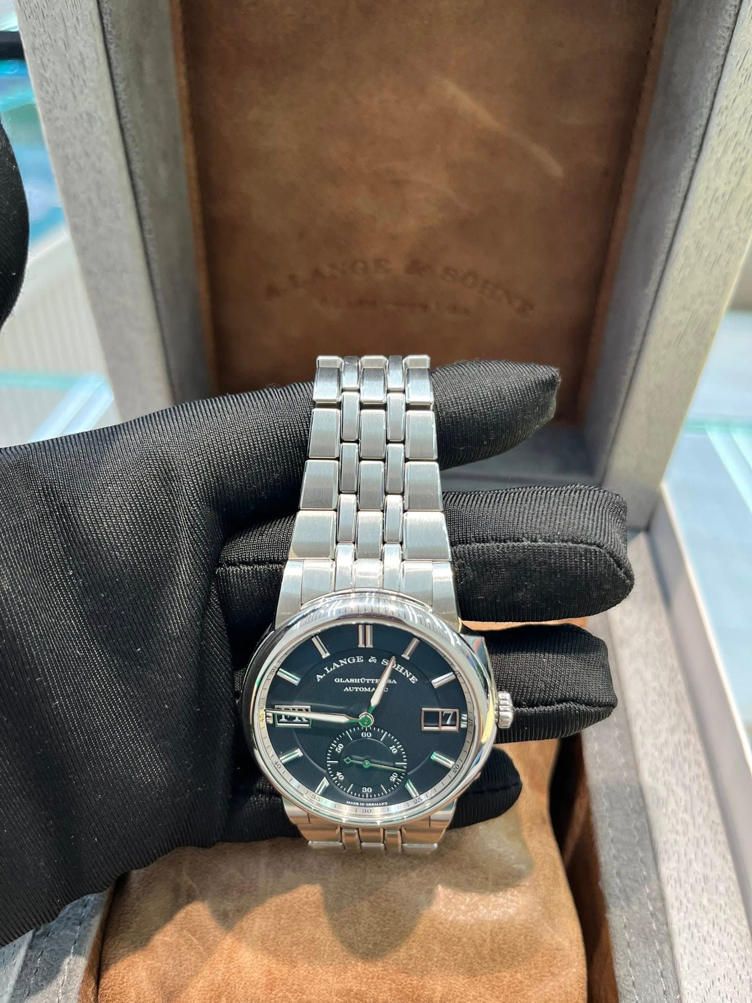 May be an image of wrist watch and text