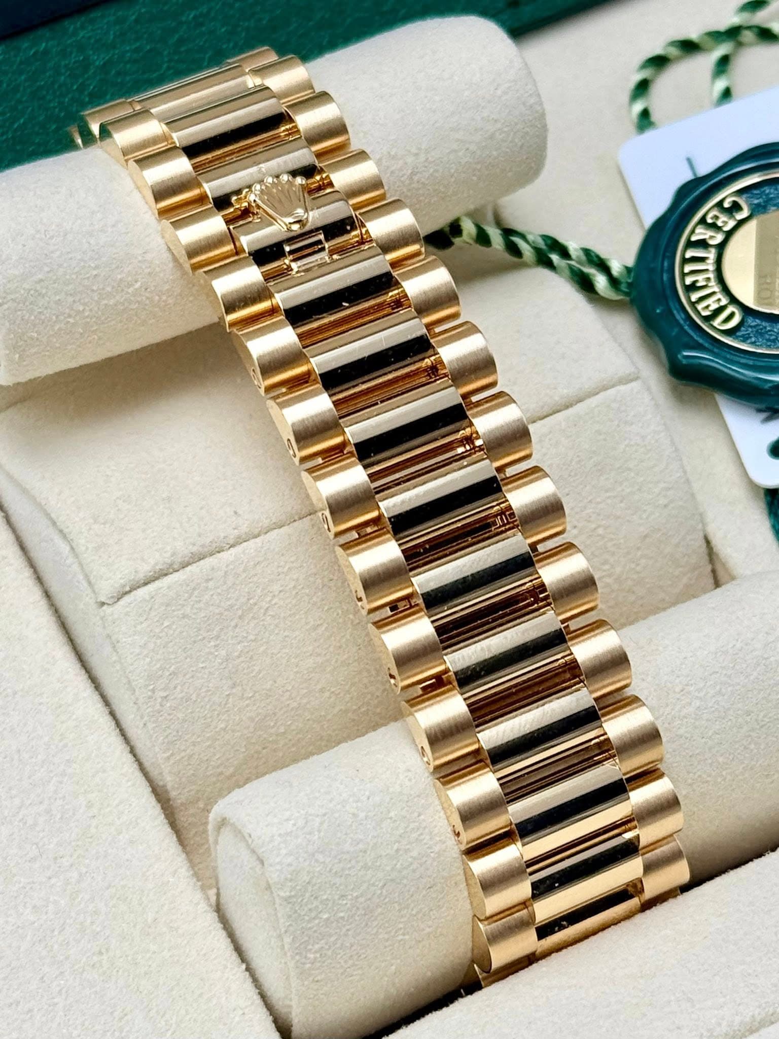 May be an image of jewelry, wrist watch and text