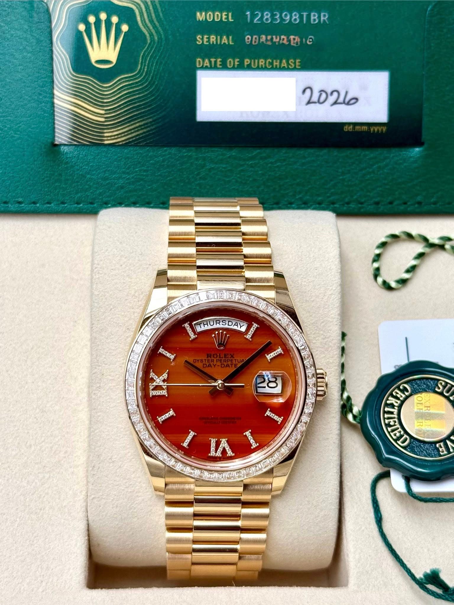May be an image of wrist watch and text