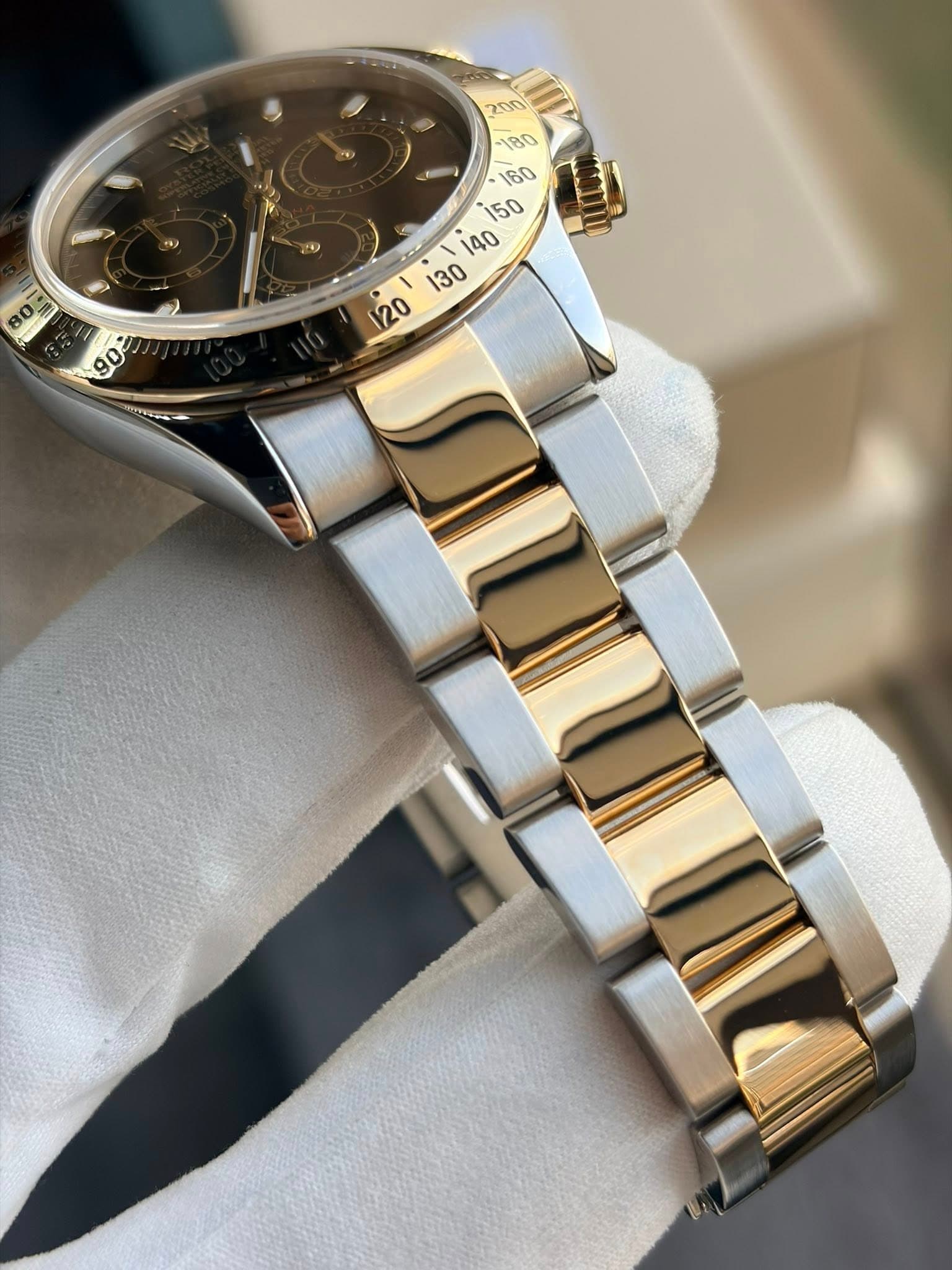 May be an image of wrist watch and text