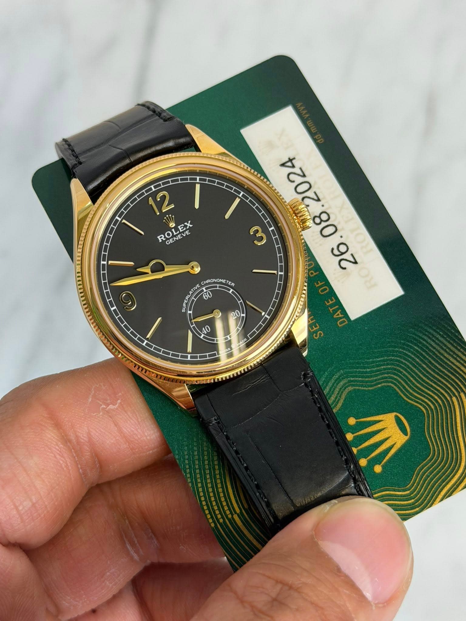 May be an image of wrist watch and text