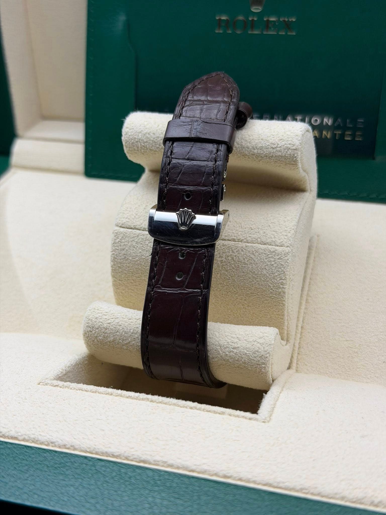 May be an image of wrist watch and text that says 'TION'