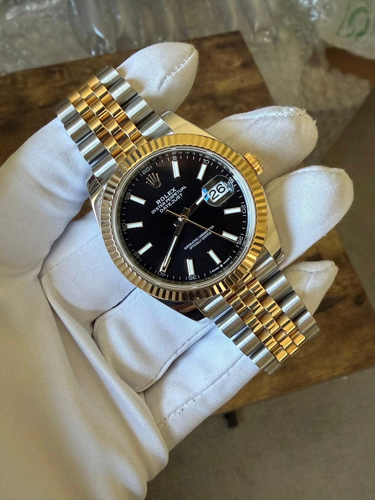 May be an image of wrist watch and text