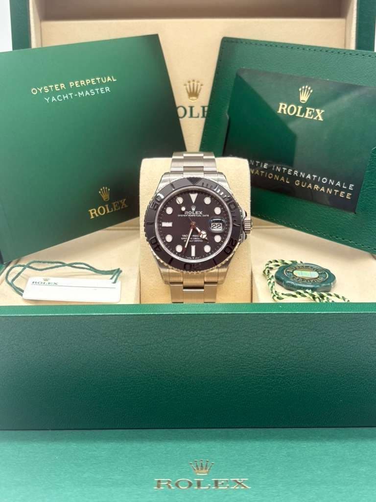 May be an image of wrist watch and text that says 'OYSTERPERPETUAL OYSTER PERPETUAL YACHT-MASTER OLE ROLEX ROL ROLEX နွန-် NAERNATIONALE INTERNATIONALE UARANTEE UARANTEE 22 و.ه…