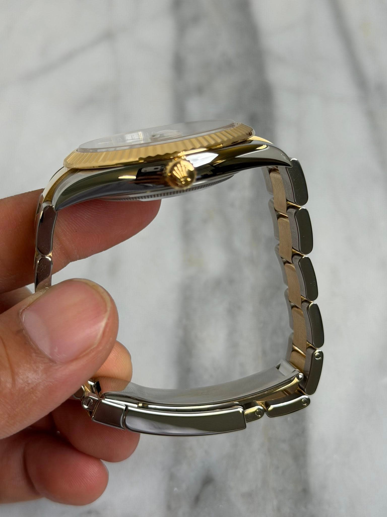 May be an image of wrist watch