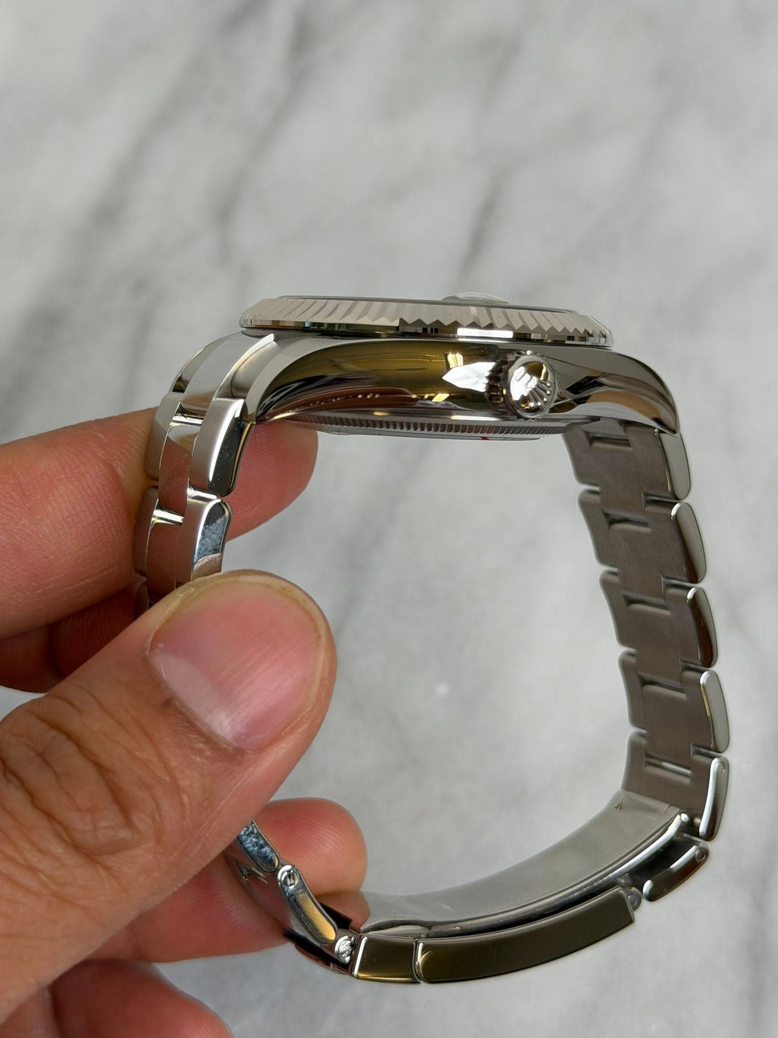 May be an image of wrist watch