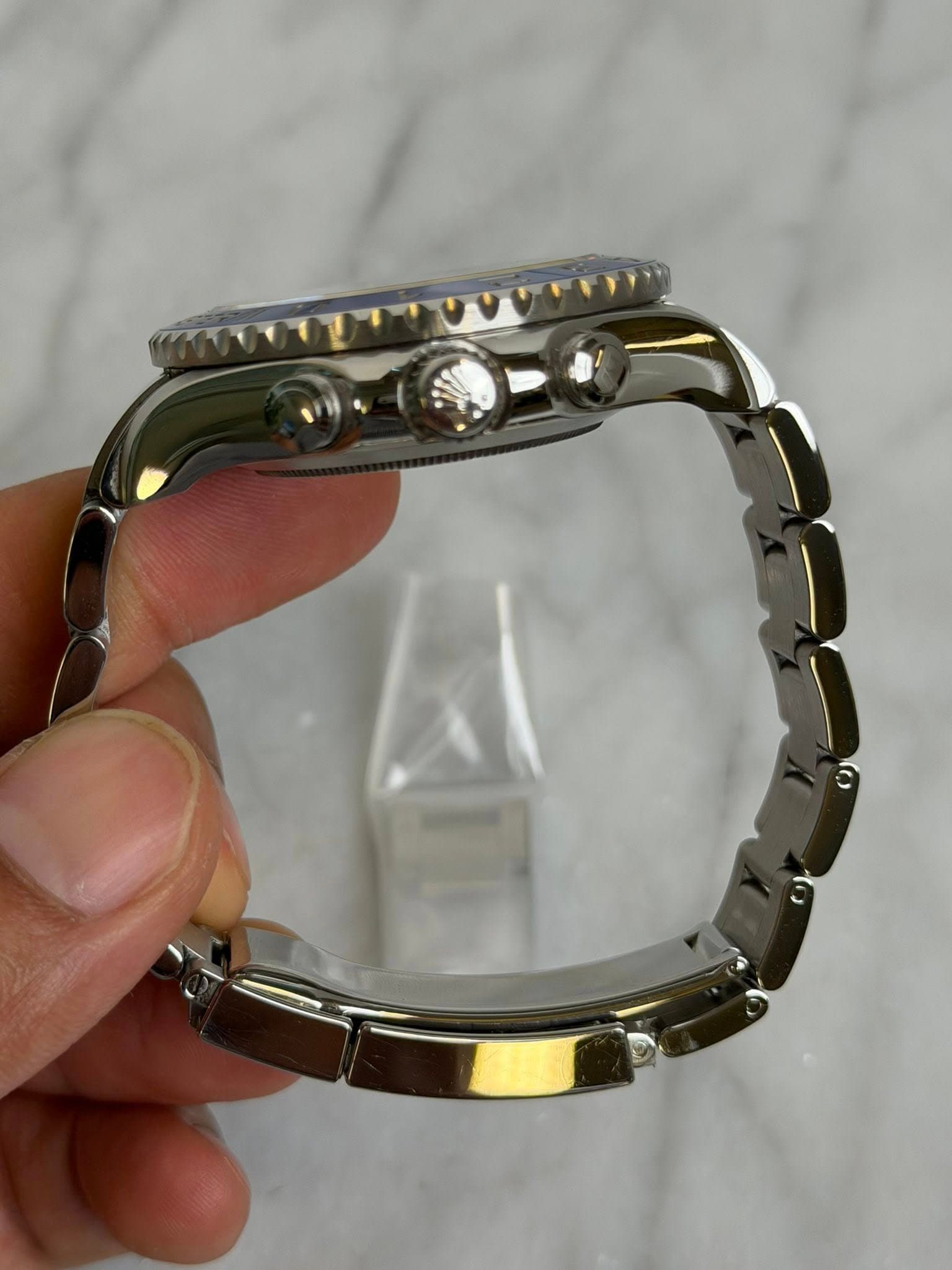 May be an image of wrist watch and jewelry
