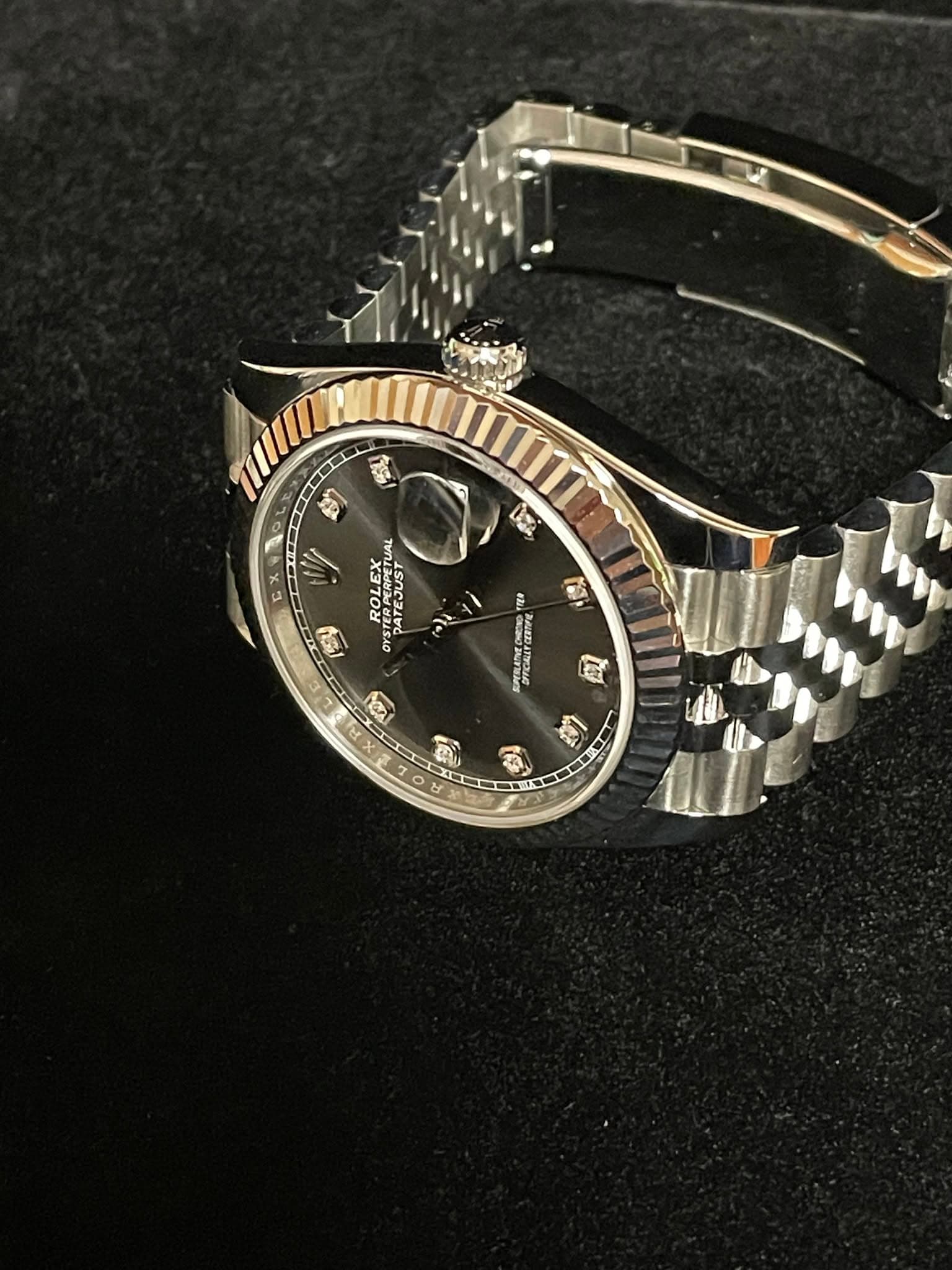 May be an image of wrist watch and text