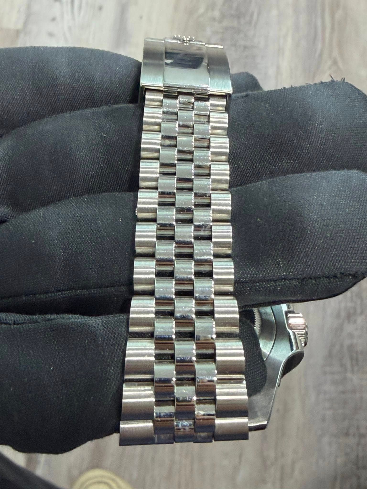 May be an image of wrist watch and text