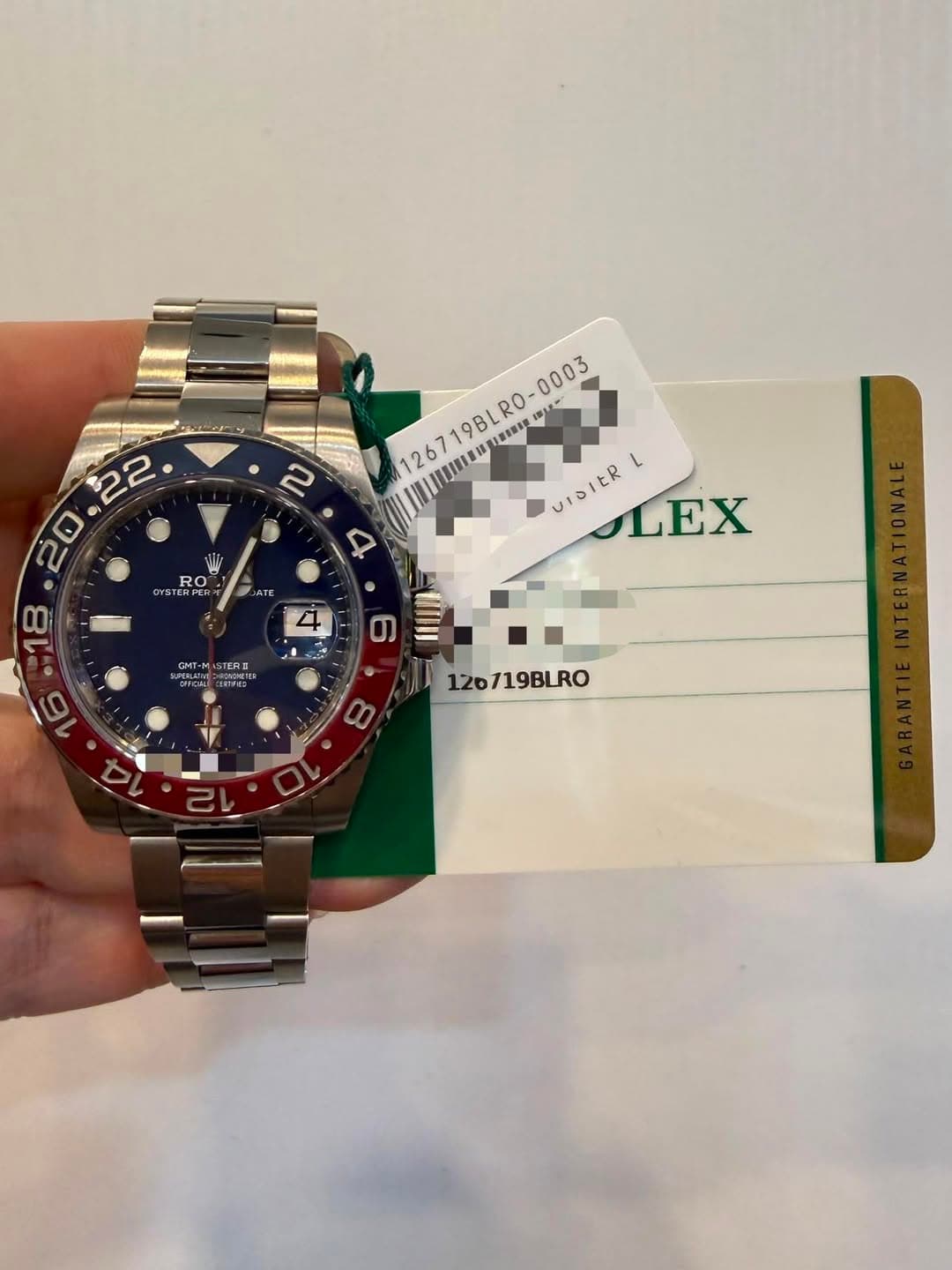 May be an image of wrist watch and text