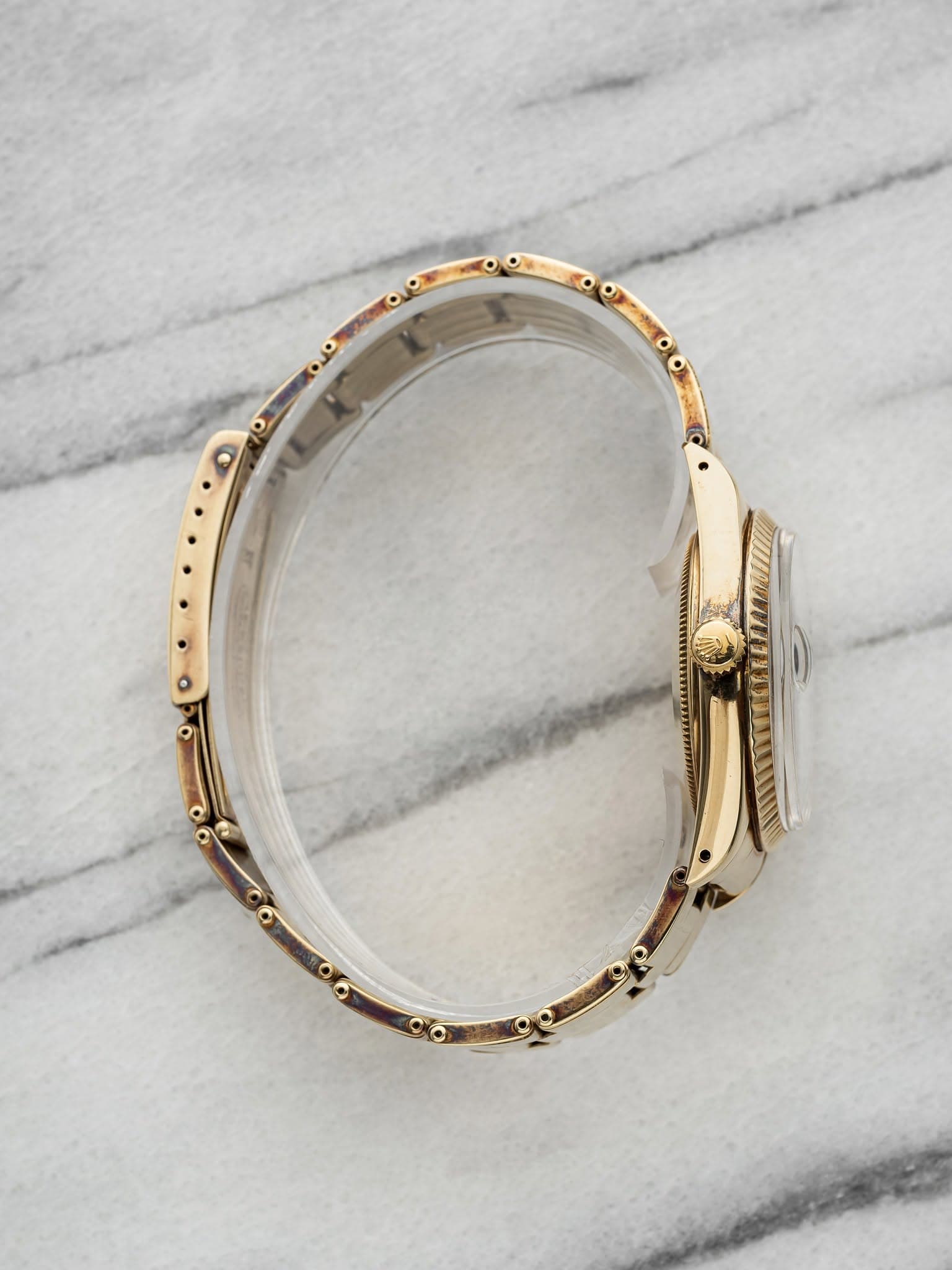 May be an image of jewelry and wrist watch