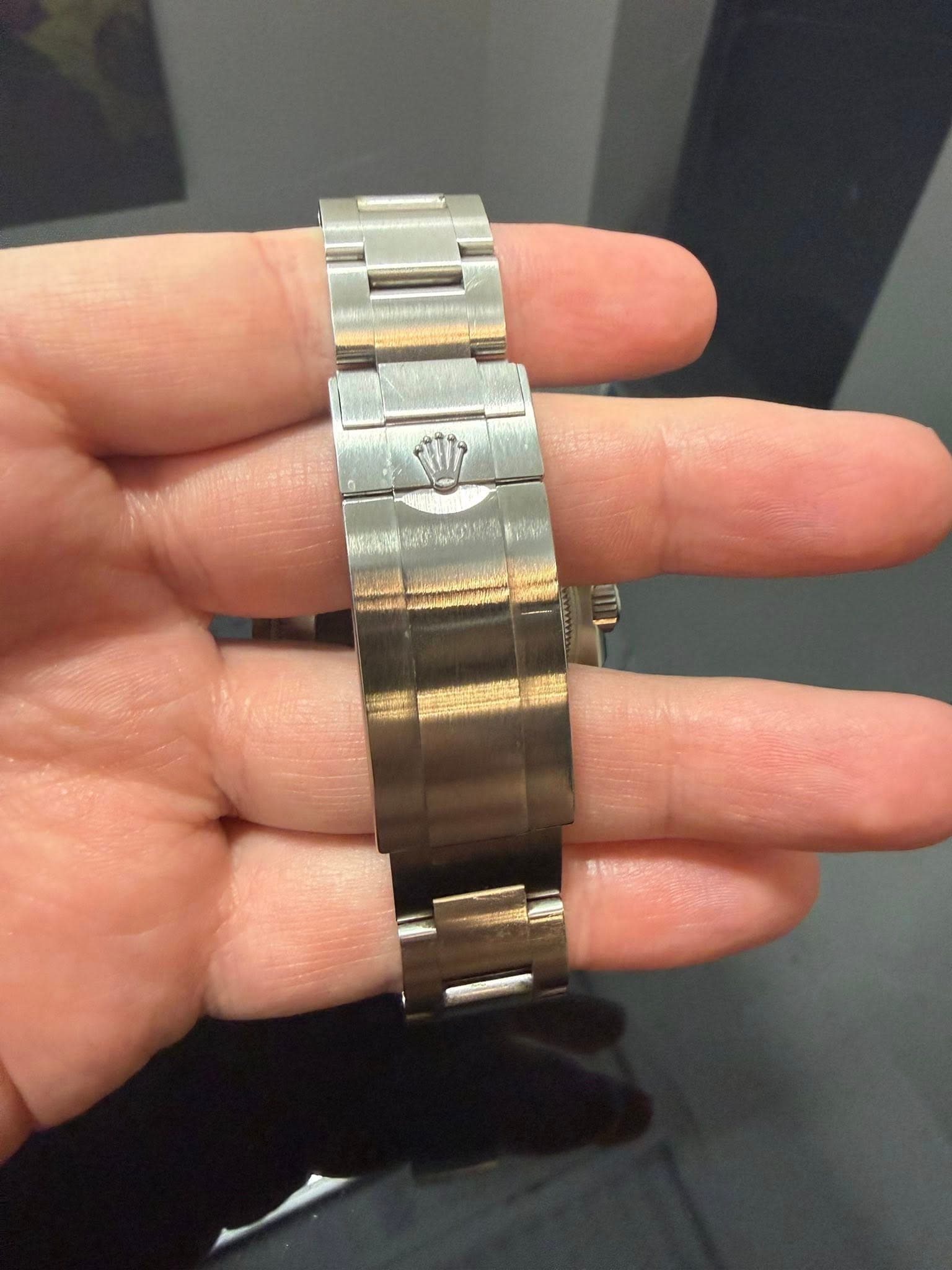 May be an image of wrist watch and text