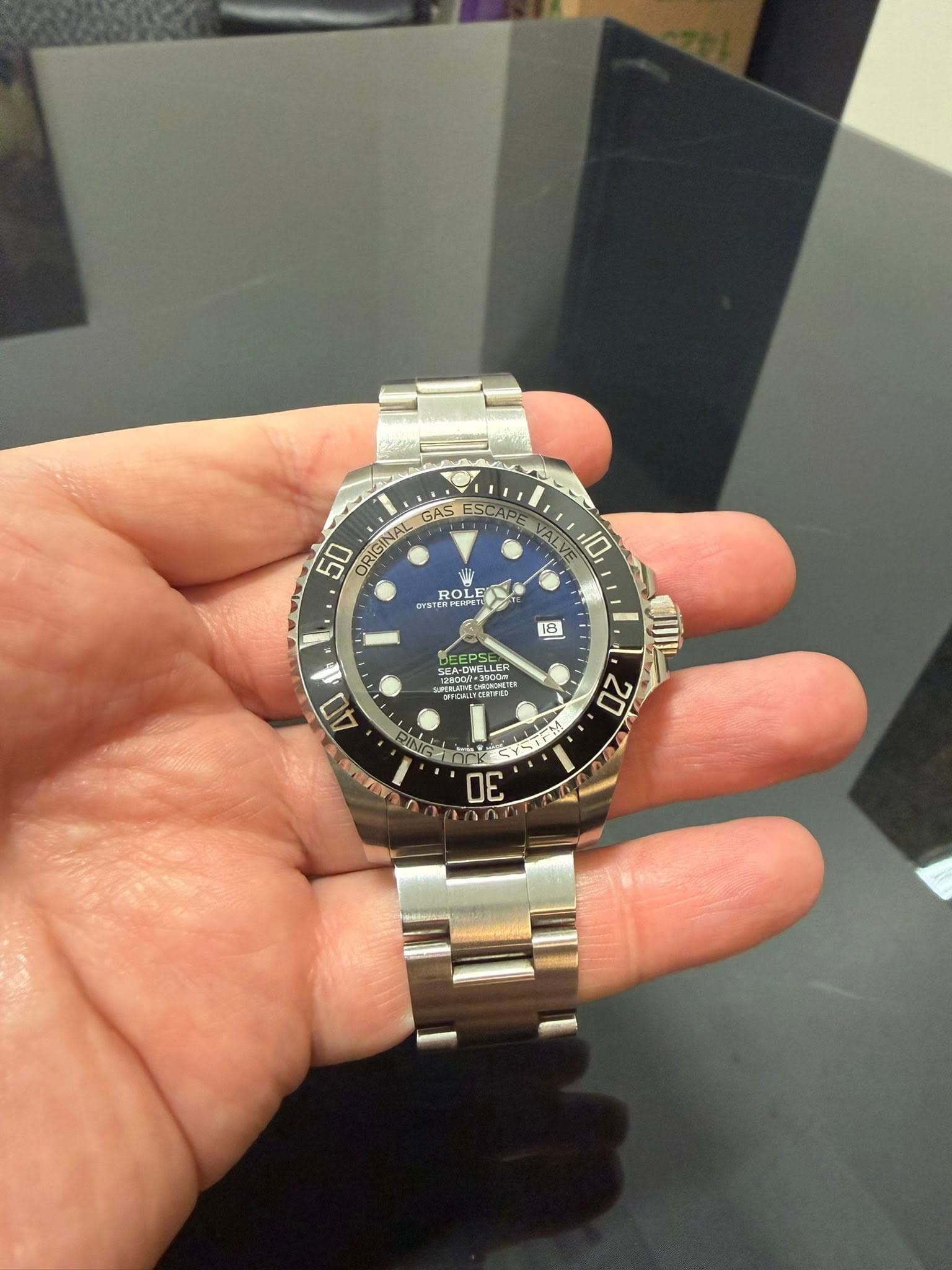 May be an image of wrist watch and text