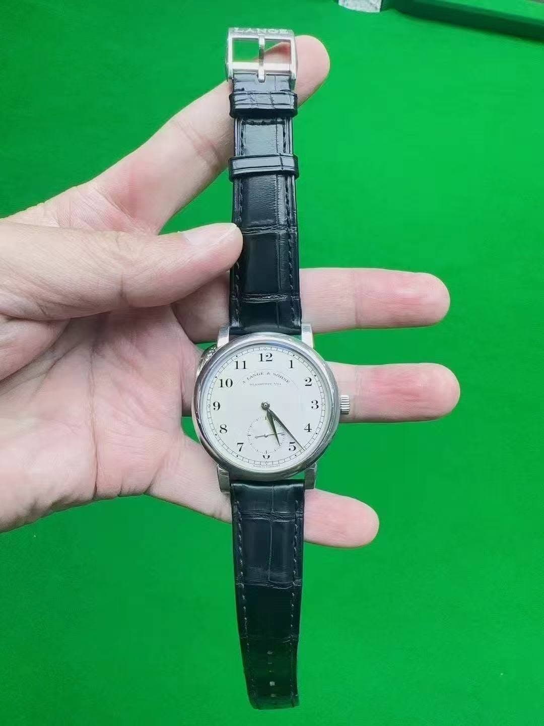 May be an image of wrist watch and text