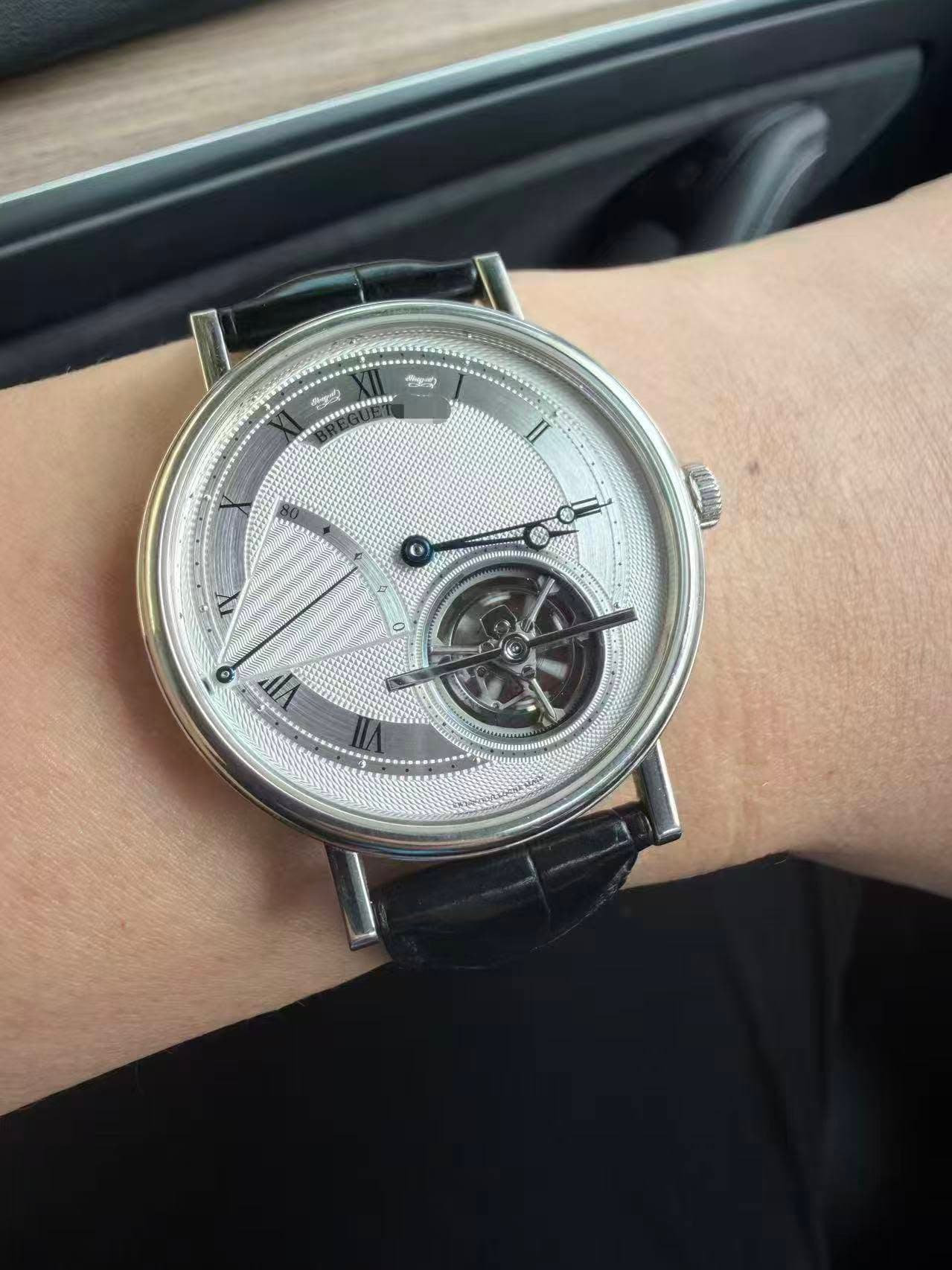 May be an image of wrist watch and text