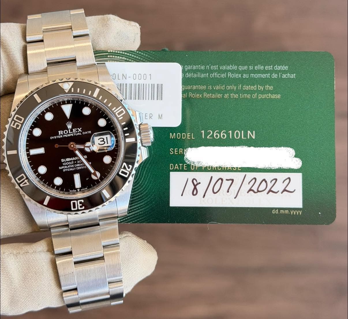 May be an image of wrist watch and text that says 'OLN- OLN- garantie 'est valable que elle est datée détaillant officiel Rolex au moment de achat guarantee valid only dated…