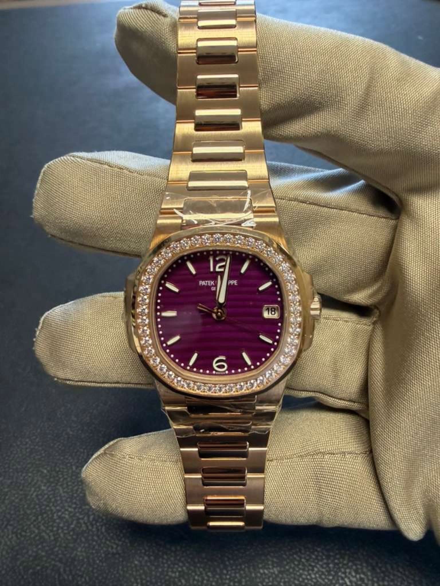 May be an image of wrist watch and text