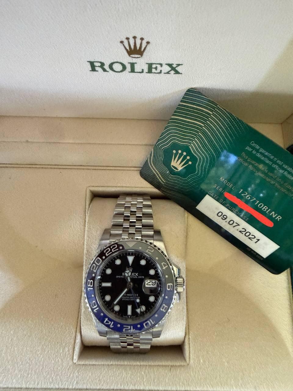 May be an image of wrist watch and text that says 'ROLEX par Celt nae détaillant. SERI ER MODEL 09.07 07 126710BLNR 1267 126710BLNR 10BL NR EX A 2 4 တ I0 8 a'
