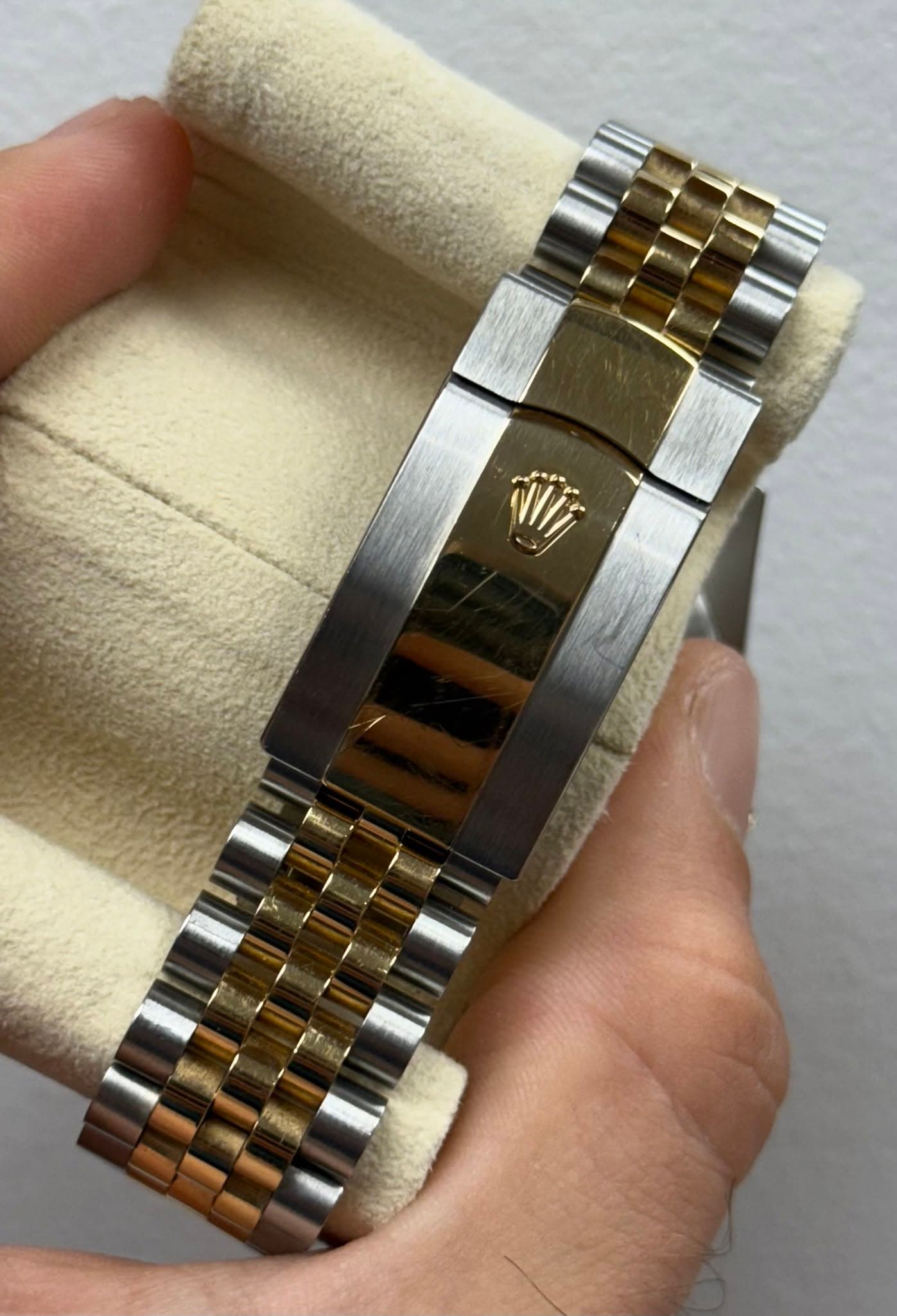 May be an image of wrist watch and text