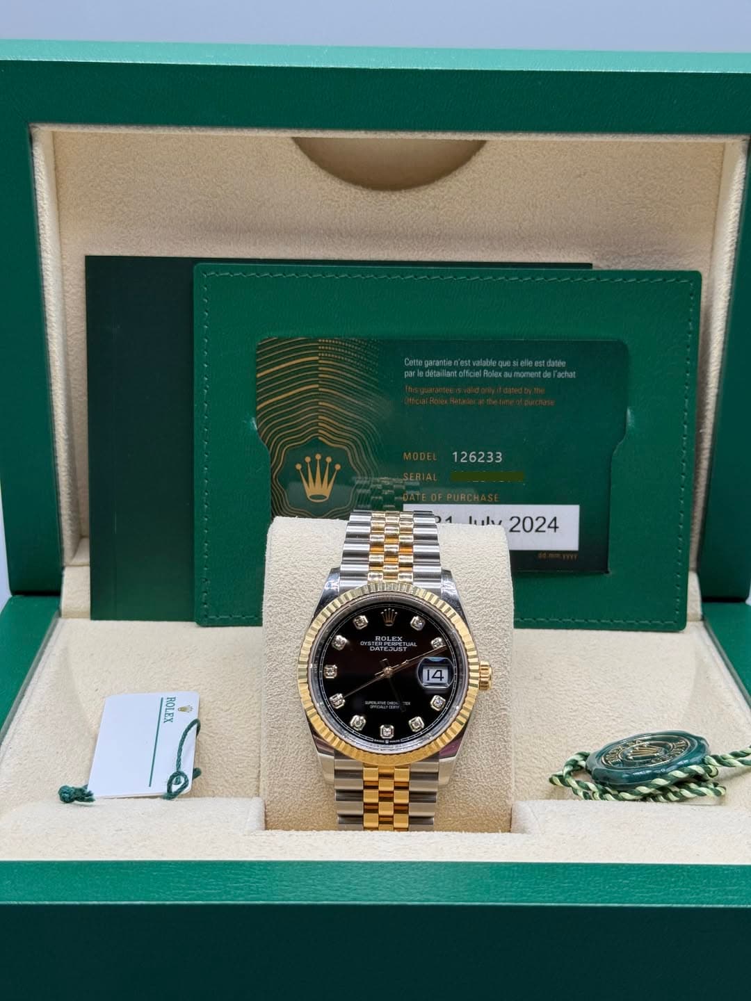 May be an image of wrist watch and text