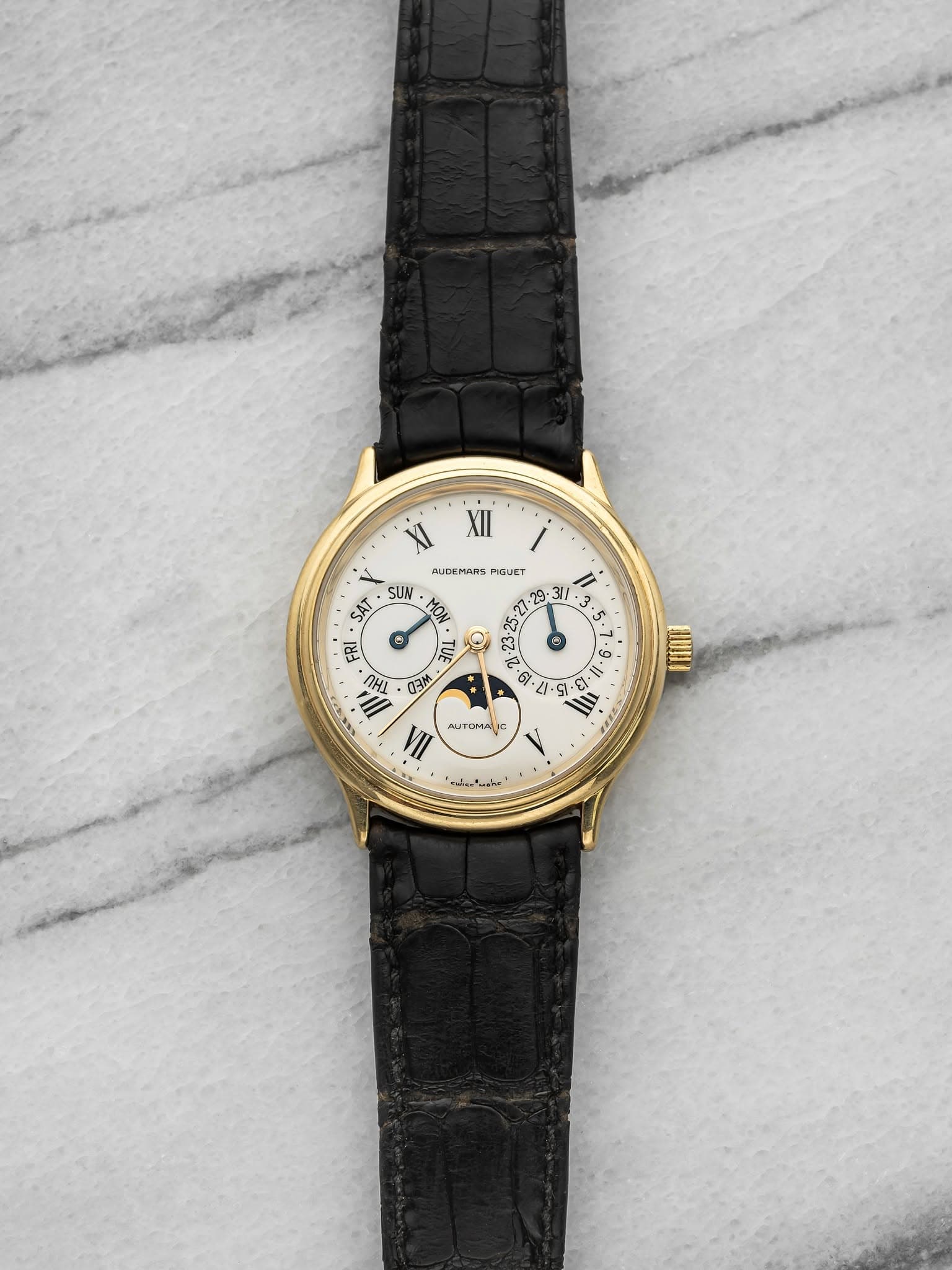May be an image of wrist watch and text