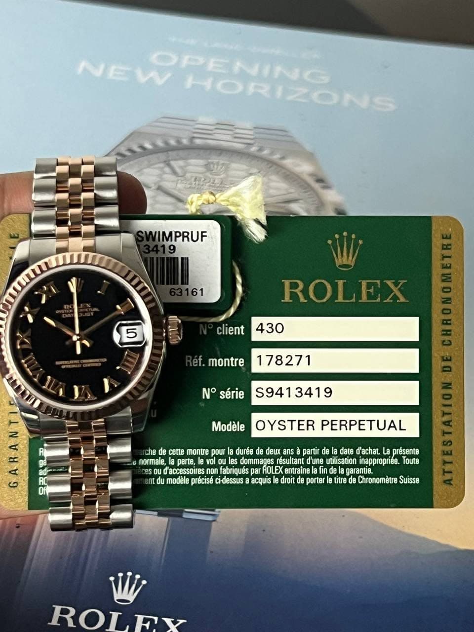 May be an image of wrist watch and text that says 'NEWPENING OPENING HORIZONS SWIMPRUF 161 5 client ROLEX 430 éf. montre 178271 N° série 9413419 Modèle OYSTER PERPETUAL ANA de…